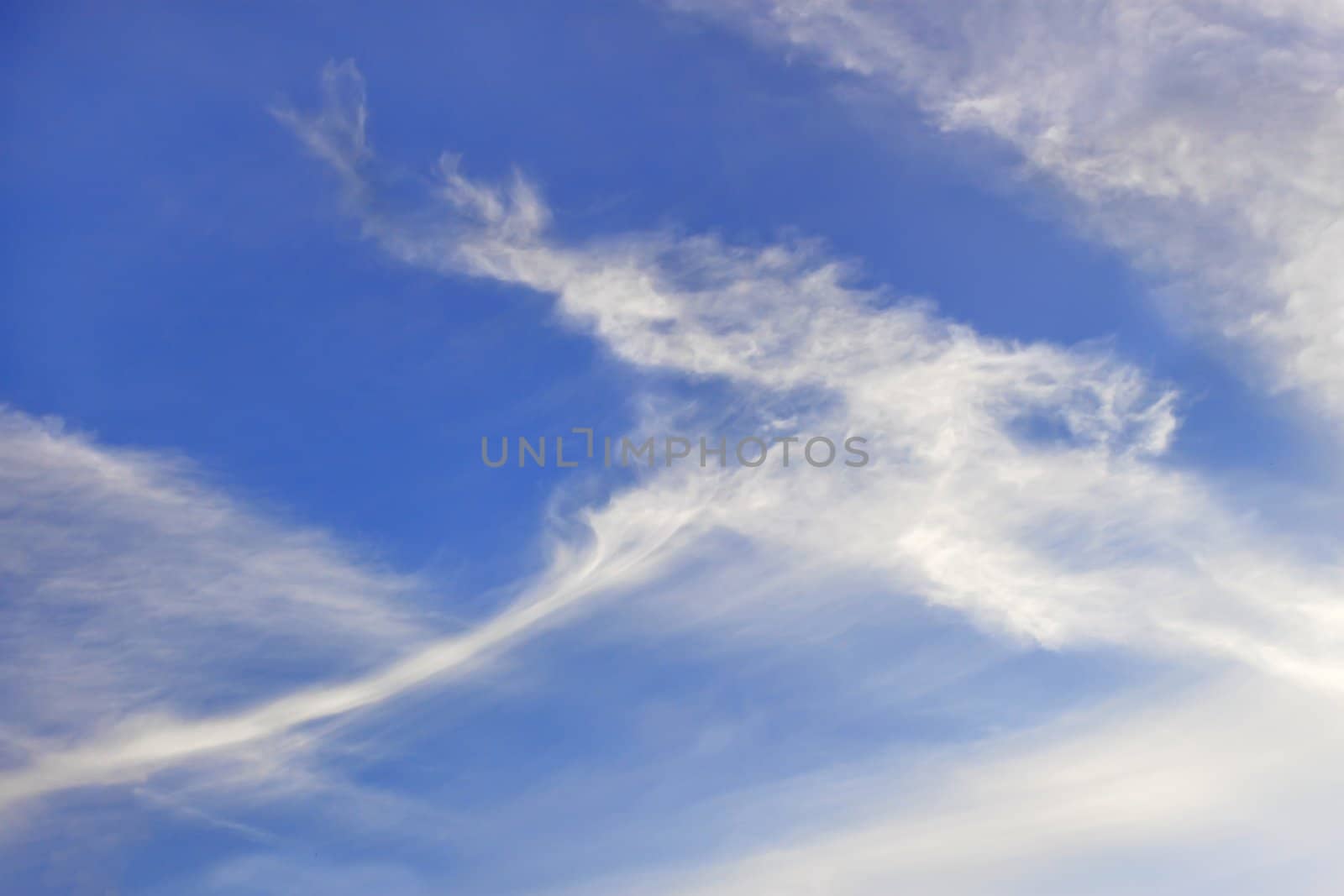 Autumn elongated stratospheric clouds against a blue sky