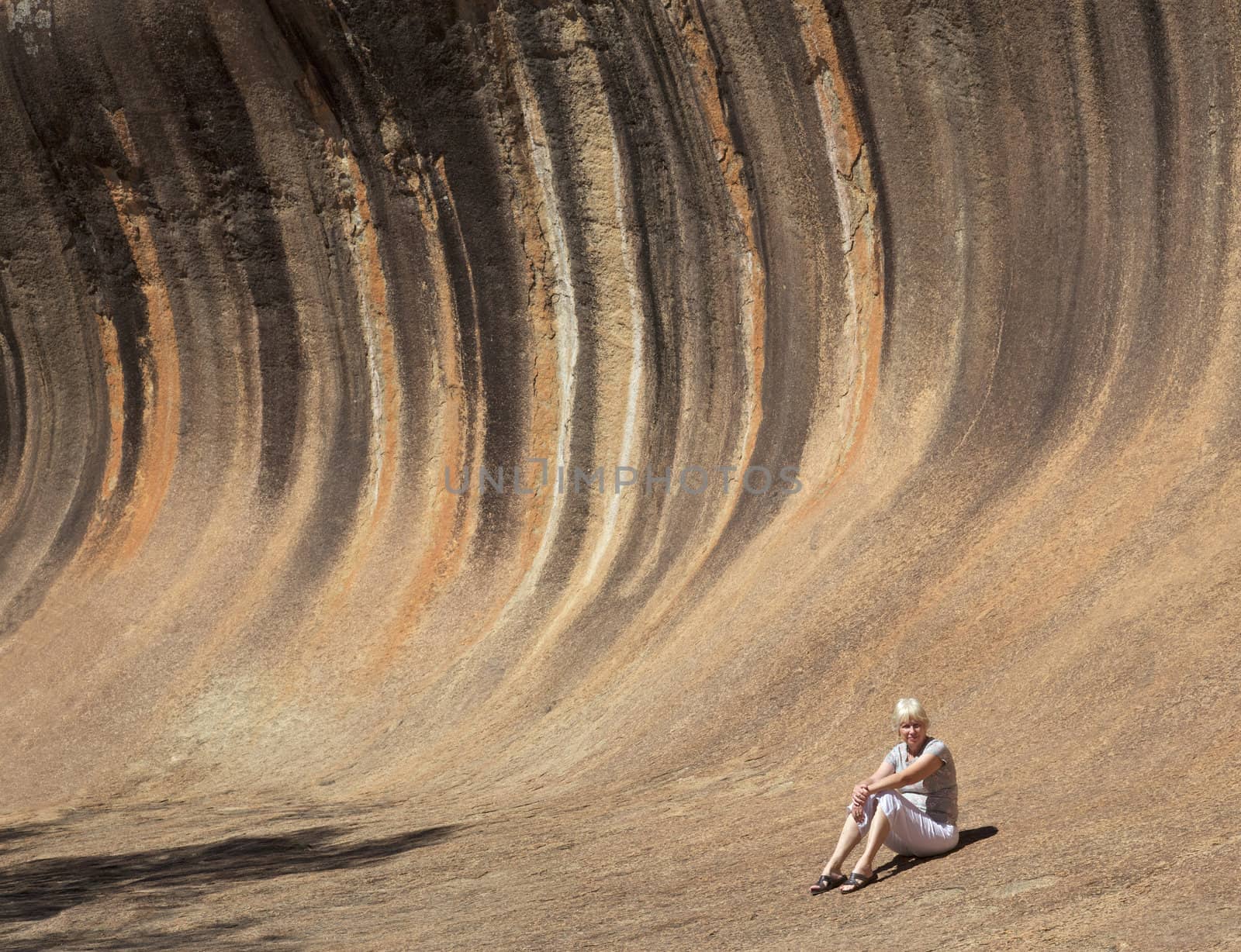 Mature woman at Wave Rock, near Hyden in Western Australia.