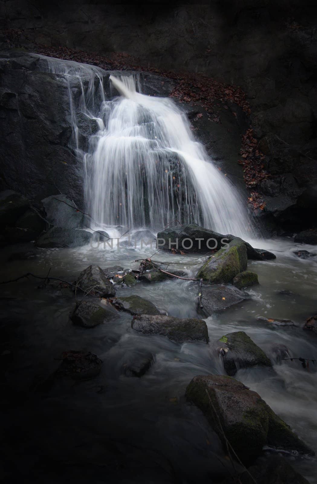 Mysterious Waterfall with dark background.