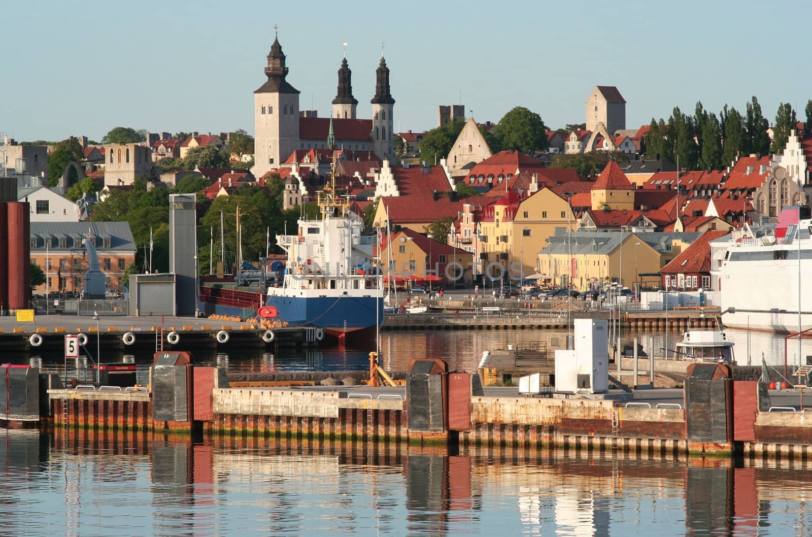 Busy town harbour with a mix of old and new.