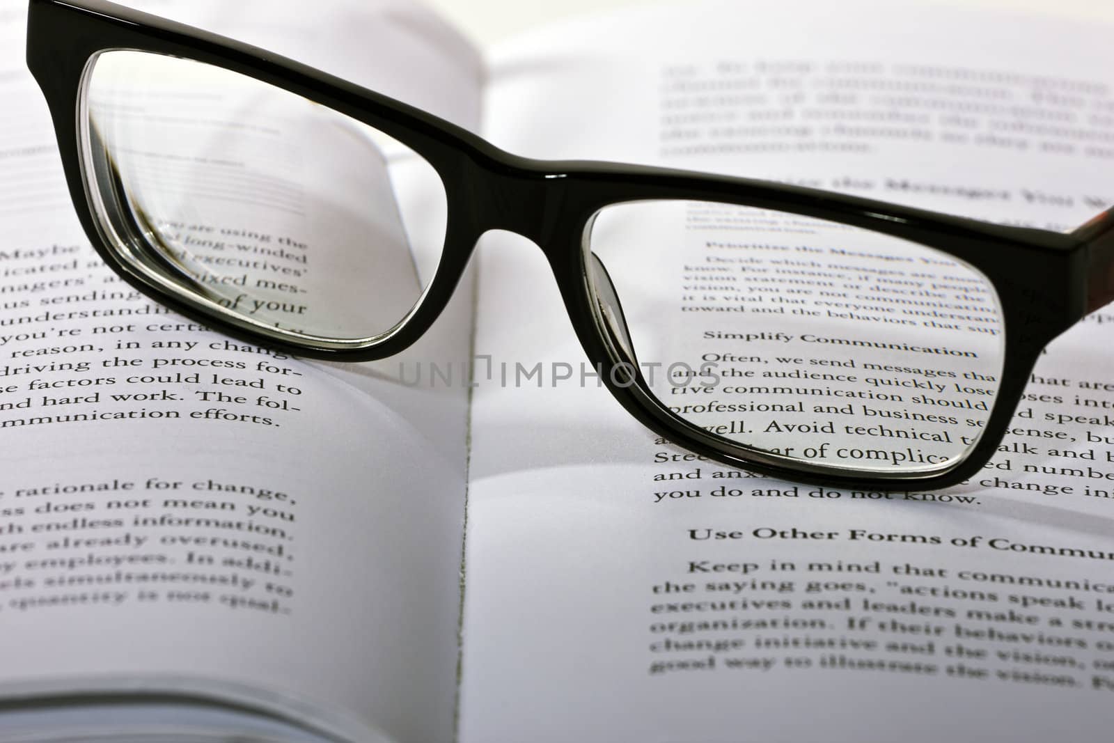 eyeglasses lie on the book by Discovod