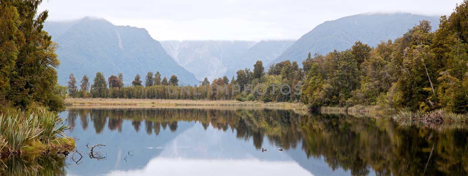 Panorama Landscape Mount cook at Lake Matheson with cloudy sky New Zealand