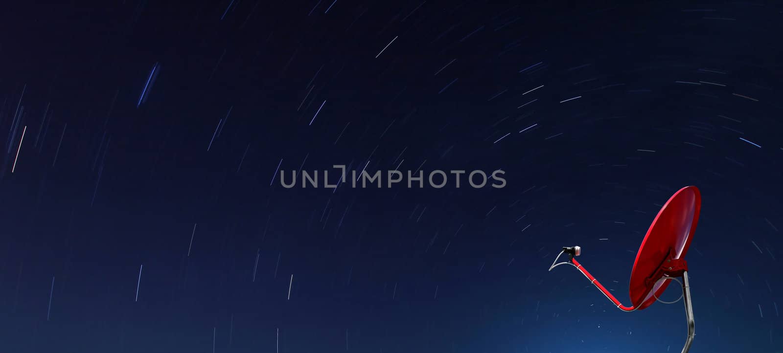 Conceptual of Red satellite over spiral star at night