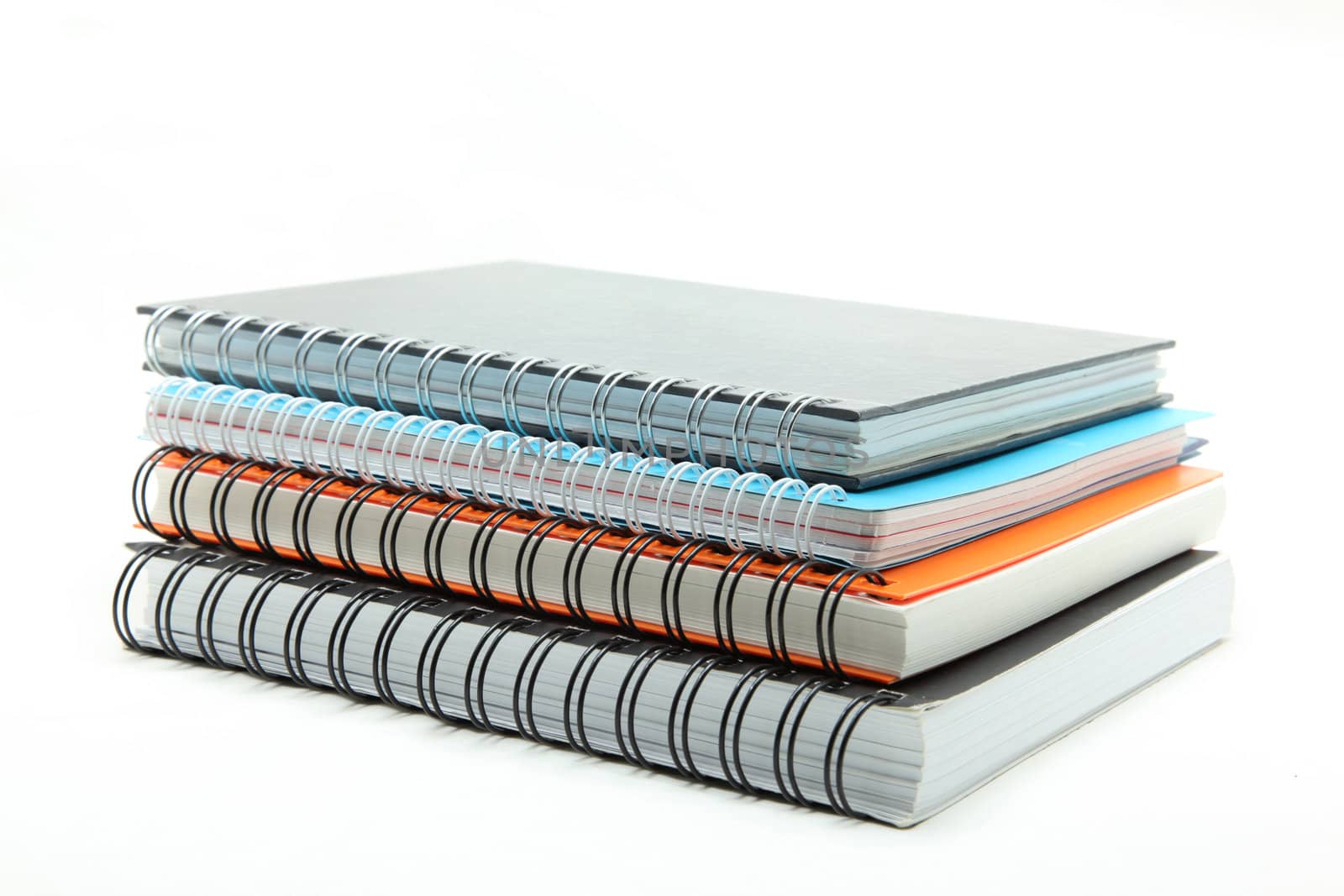 stack of ring binder hard cover book isolated on white