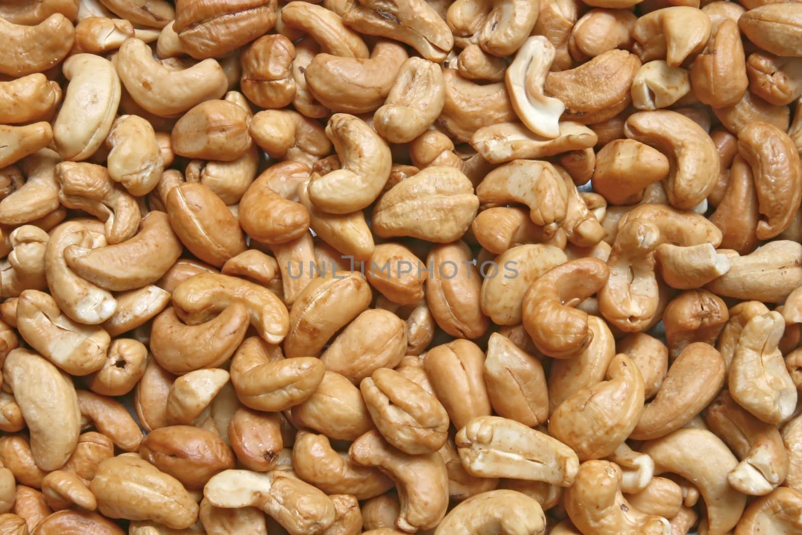 Closeup of Roasted Cashew with salt using as background
