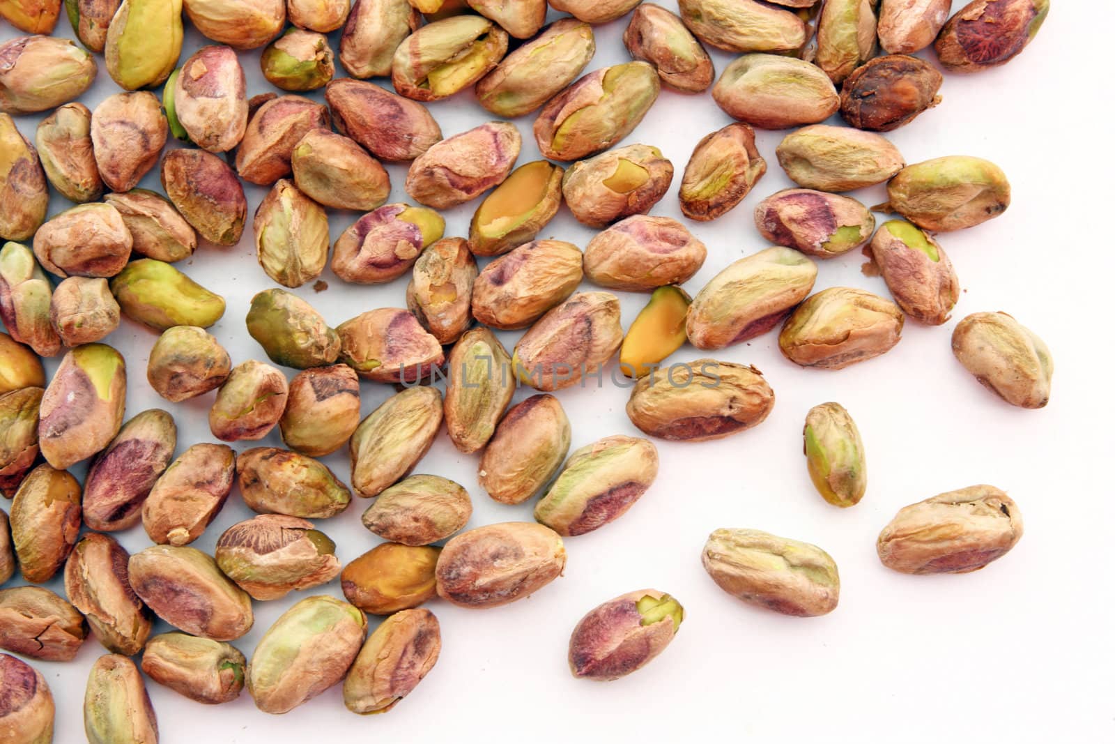 heap of roasted Pistachio isolated on white