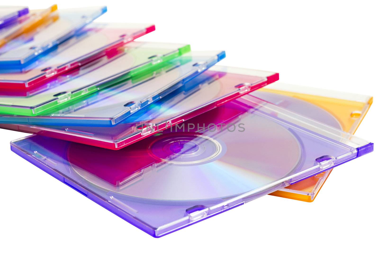 colorful CDs in boxes piled in a heap isolated on a white background