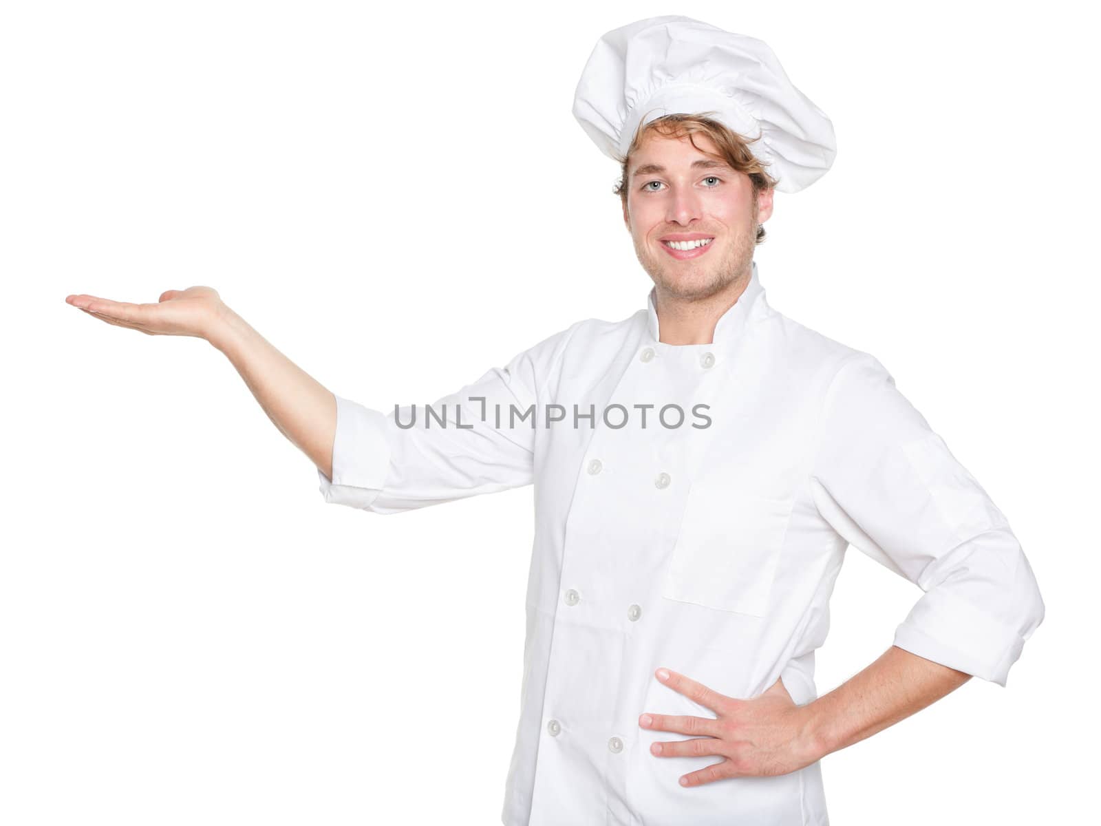 Chef, Cook or baker showing isolated. Male chef presenting your product. Young Caucasian man isolated on white background in chefs uniform.