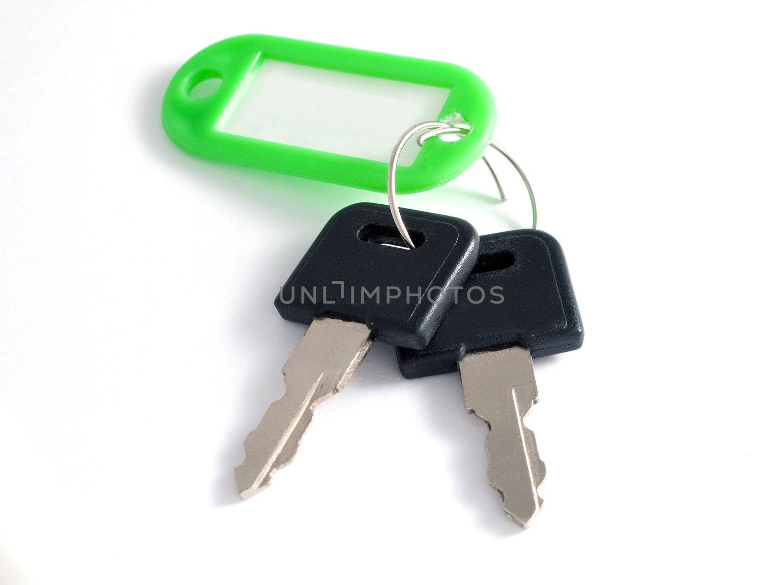 Bunch of metal house key on ring isolated on white