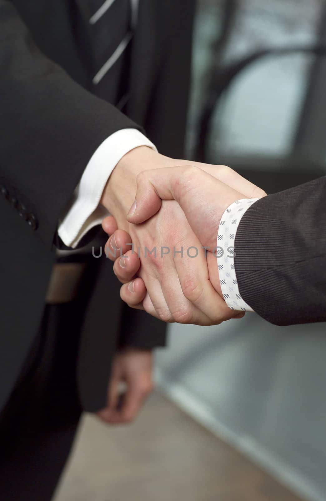 Close-up of a handshake with selective focus