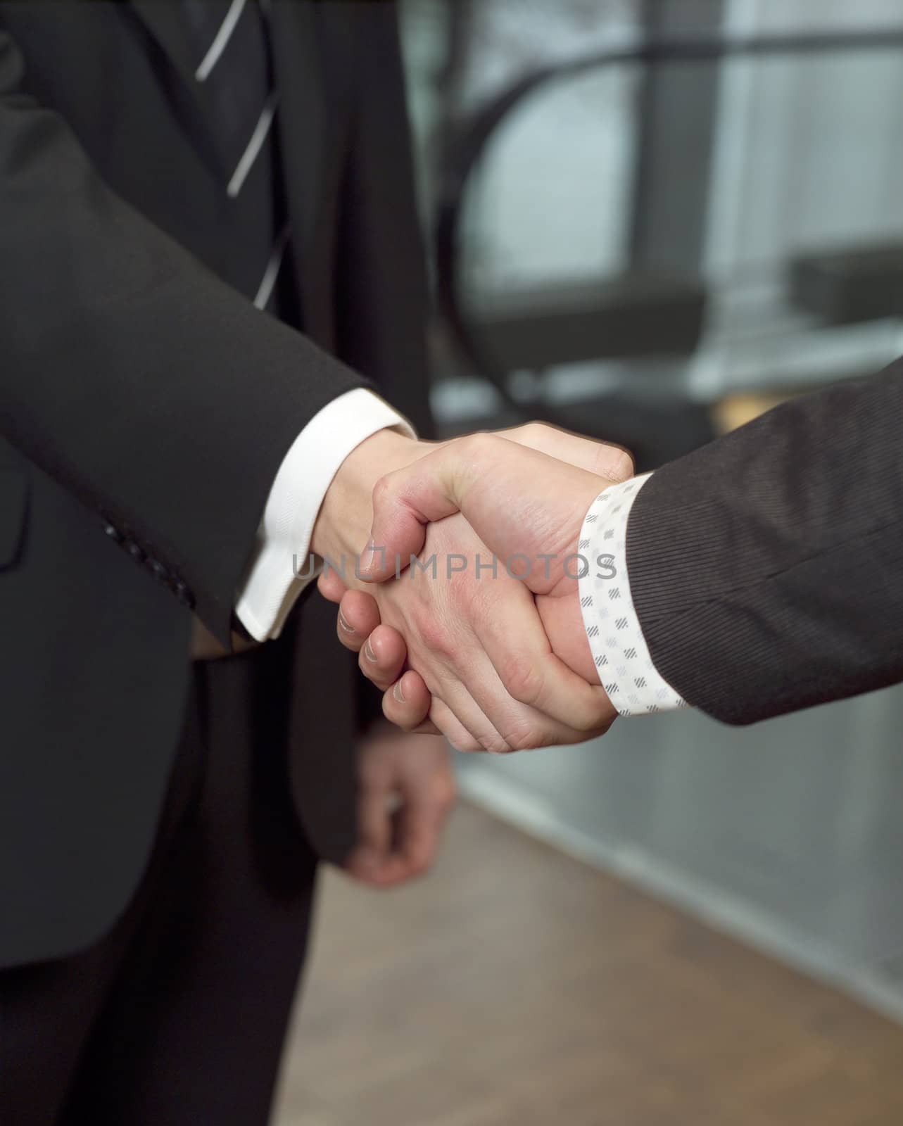 Close-up of a handshake with selective focus