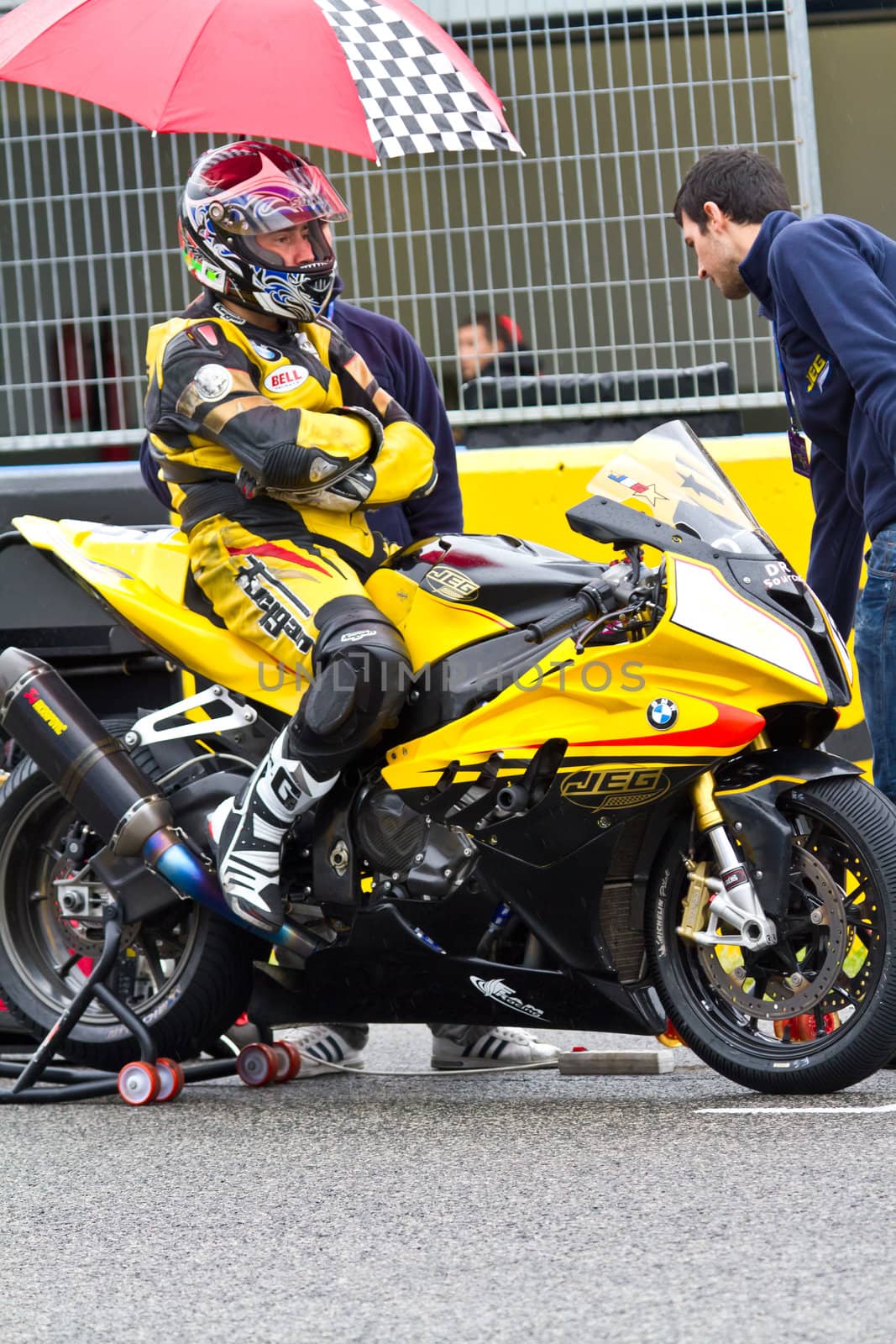 JEREZ DE LA FRONTERA, SPAIN - NOV 20: Stock Extreme motorcyclist Juan Eric Gomez waiting on the starting gates in in the CEV Championship race on November 20, 2011 in Jerez de la Frontera, Spain