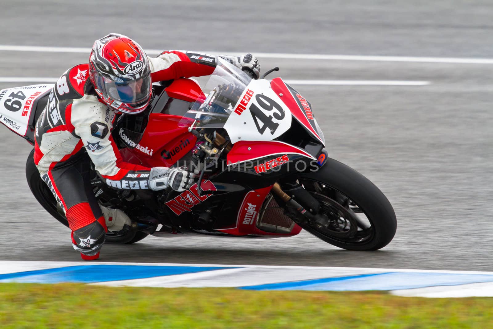 JEREZ DE LA FRONTERA, SPAIN - NOV 20: Stock Extreme motorcyclist Raul Martinez takes a curve in the CEV Championship race on November 20, 2011 in Jerez de la Frontera, Spain