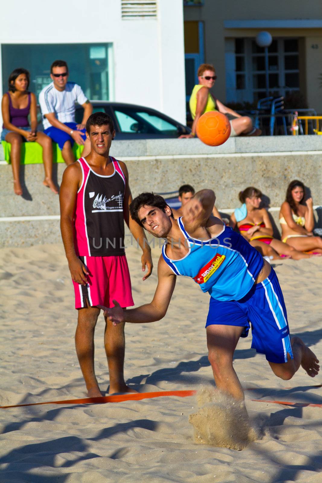CADIZ, SPAIN - JULY 19: Unidentified players compete in a match between Zonabalonmano.com and CadizSur Seguros BMPY in the 19th league of beach handball of Cadiz on July 19, 2011 in Cadiz, Spain