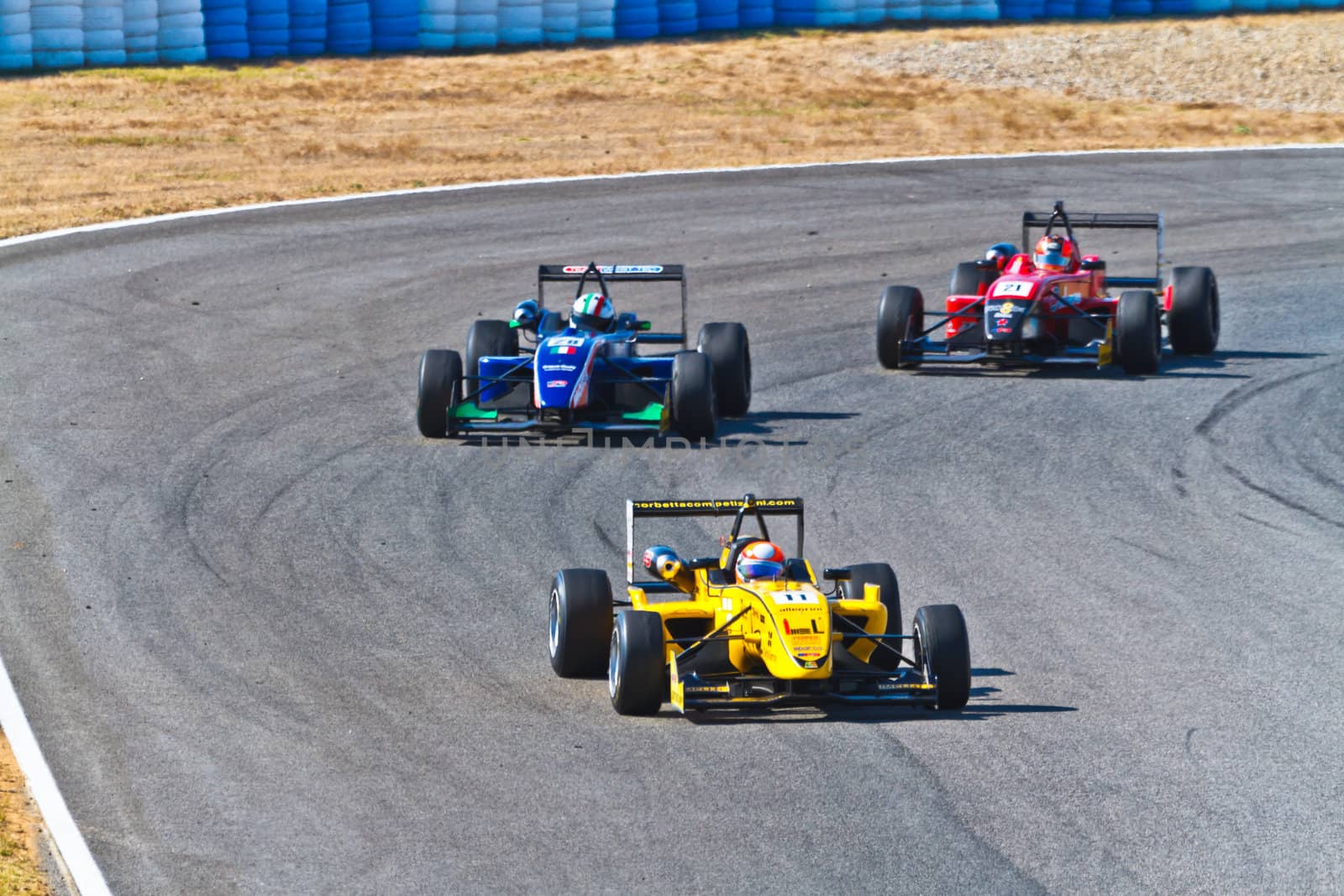 JEREZ DE LA FRONTERA, SPAIN - OCT 16: Matteo Torta (11) followed by Luca Orlandi (28) and Manuel Bajarano (21)races on European F3 championship on October 16 , 2011, in Jerez de la Frontera , Spain