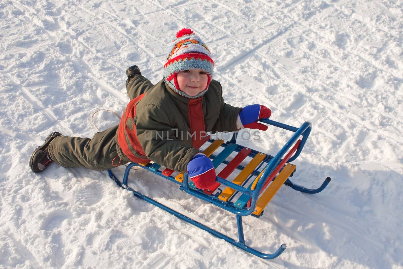 Little child fun winter outdoor snow sport sled