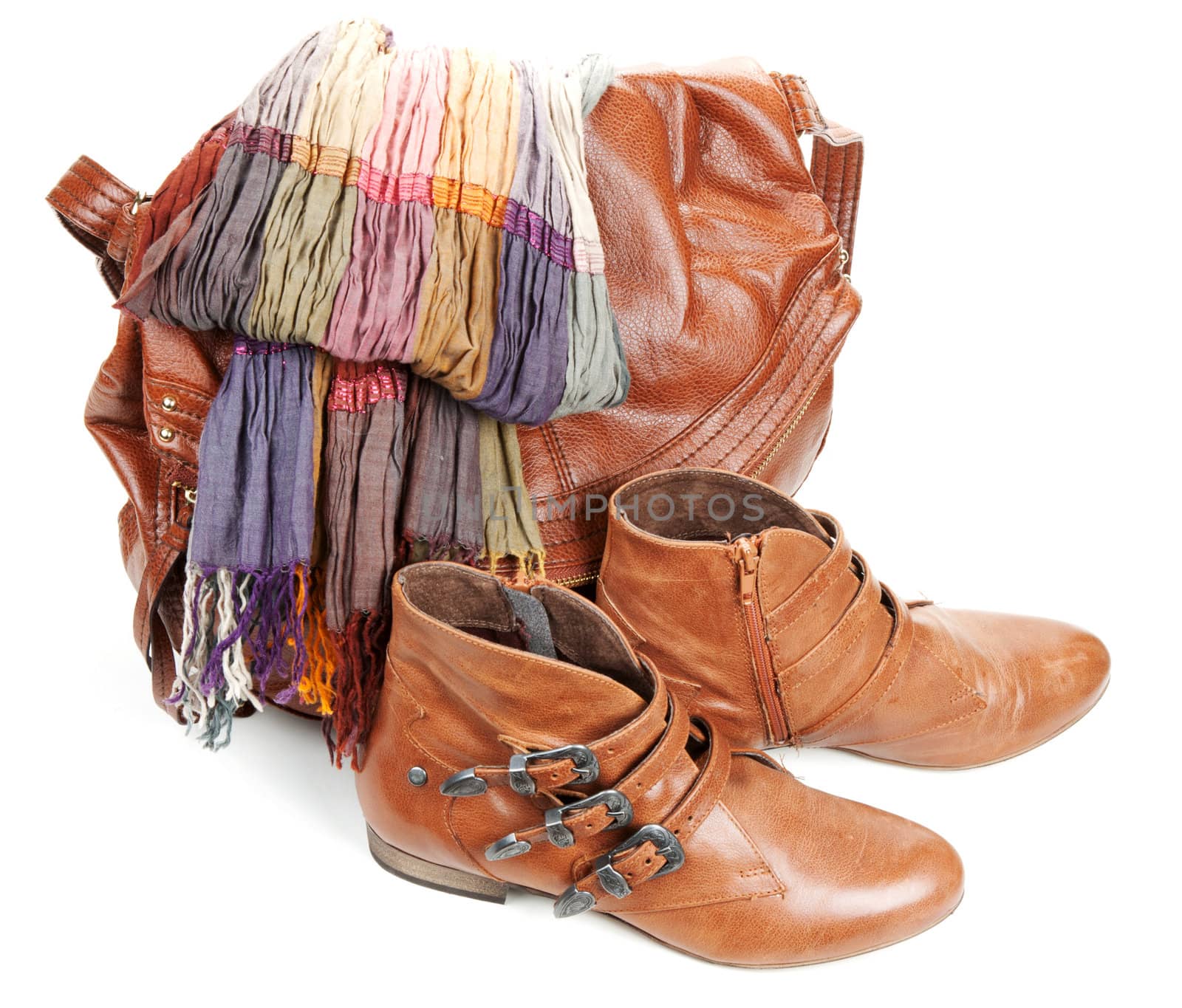 Brown leather bag, scarf and pair feminine boots on white background
