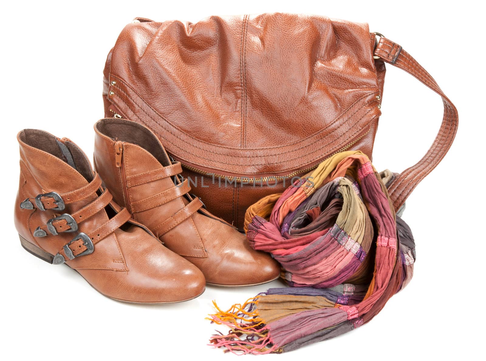 Brown leather bag, scarf and pair feminine boots on white background
