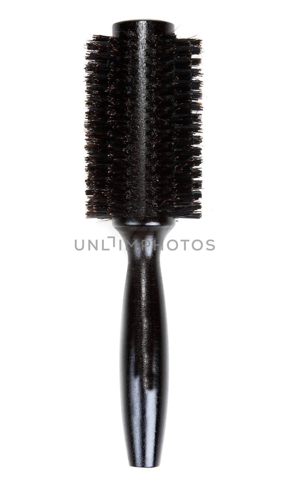 One black massages comb on white background