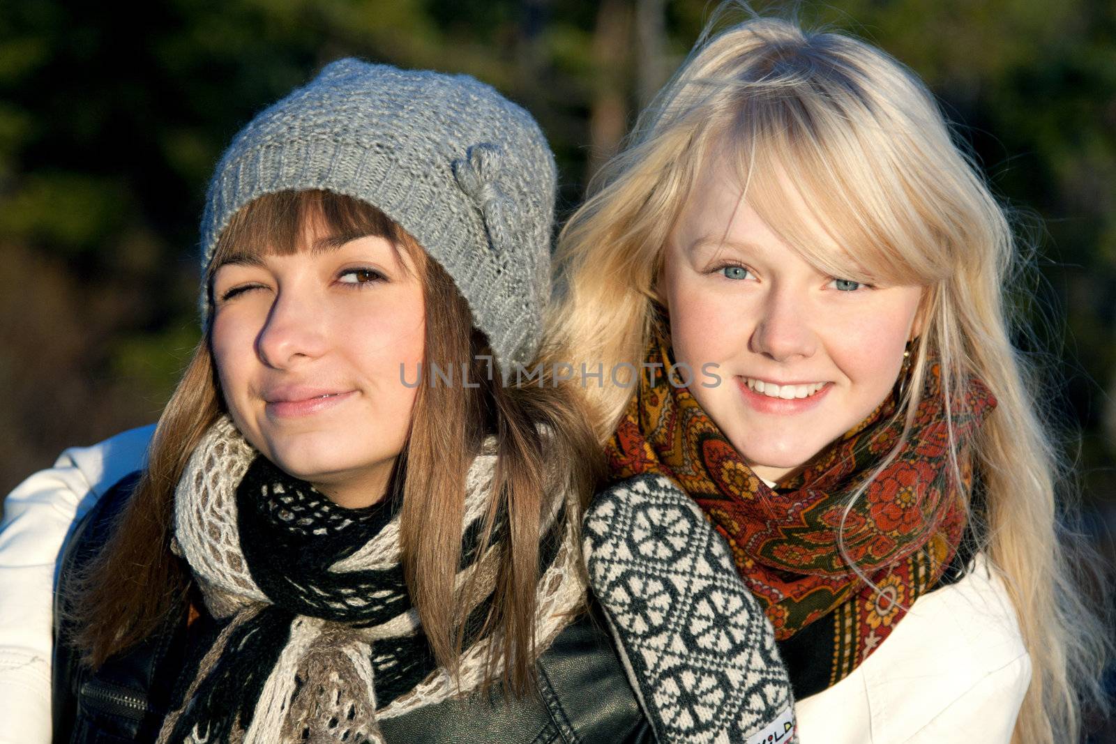 Portrait two young beautiful girls in wood