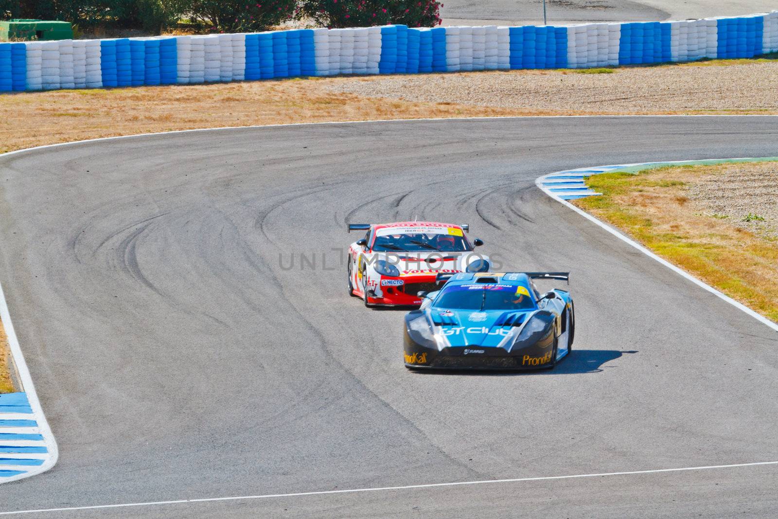 JEREZ DE LA FRONTERA, SPAIN - OCT 16: Ferran Monje(4) followed by Francesc Gutierrez(42)races on Iber GT championship on October 16 , 2011, in Jerez de la Frontera , Spain