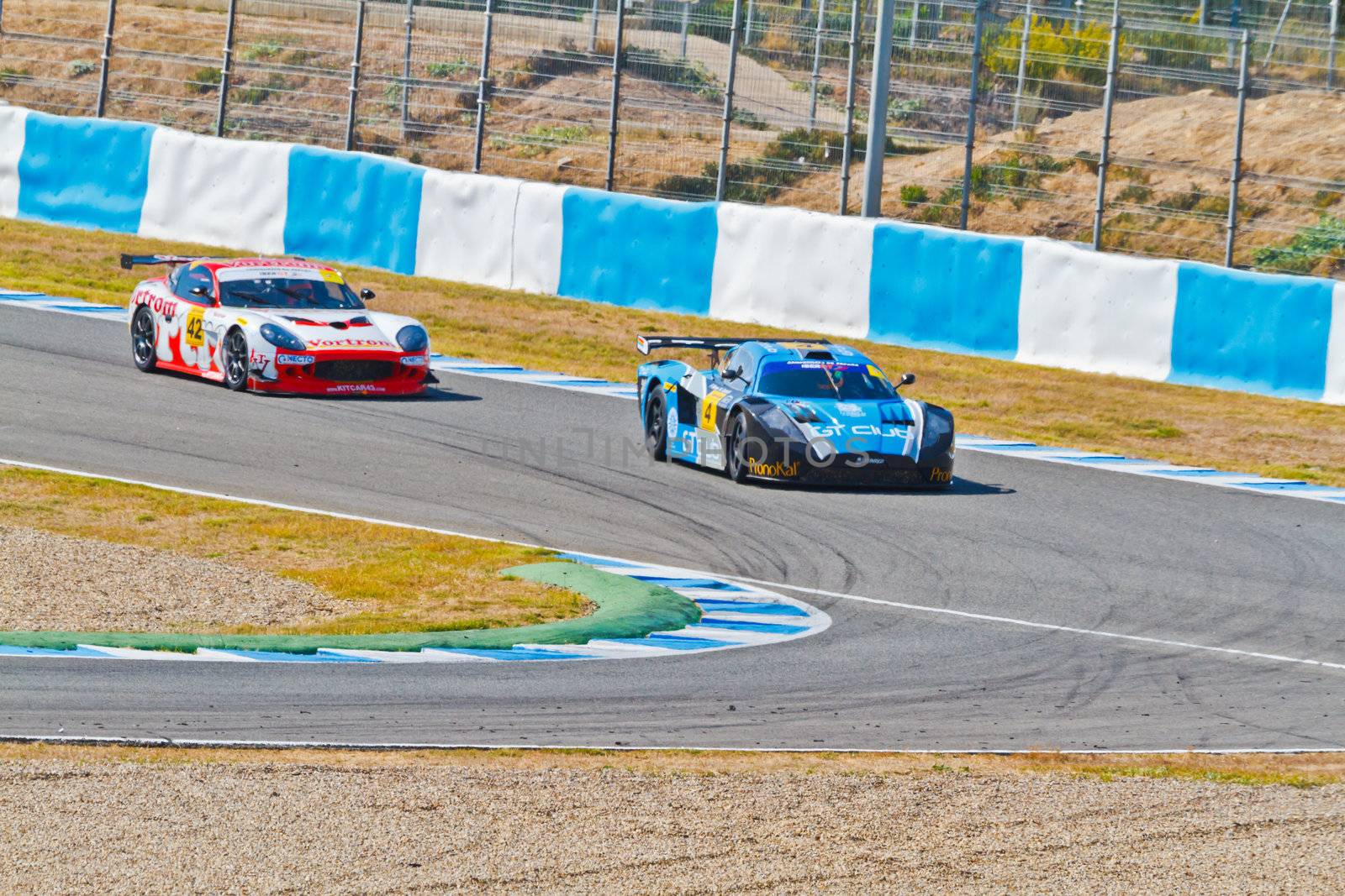 JEREZ DE LA FRONTERA, SPAIN - OCT 16: Ferran Monje(4) followed by Francesc Gutierrez(42)races on Iber GT championship on October 16 , 2011, in Jerez de la Frontera , Spain