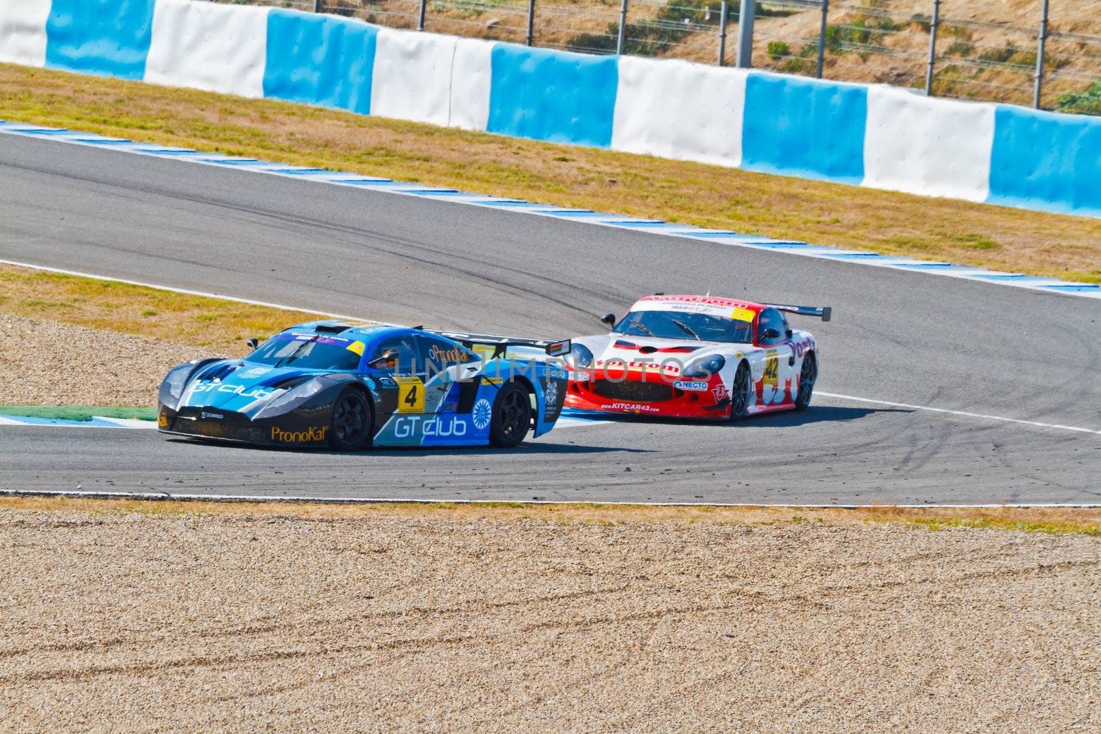 JEREZ DE LA FRONTERA, SPAIN - OCT 16: Ferran Monje(4) followed by Francesc Gutierrez(42)races on Iber GT championship on October 16 , 2011, in Jerez de la Frontera , Spain