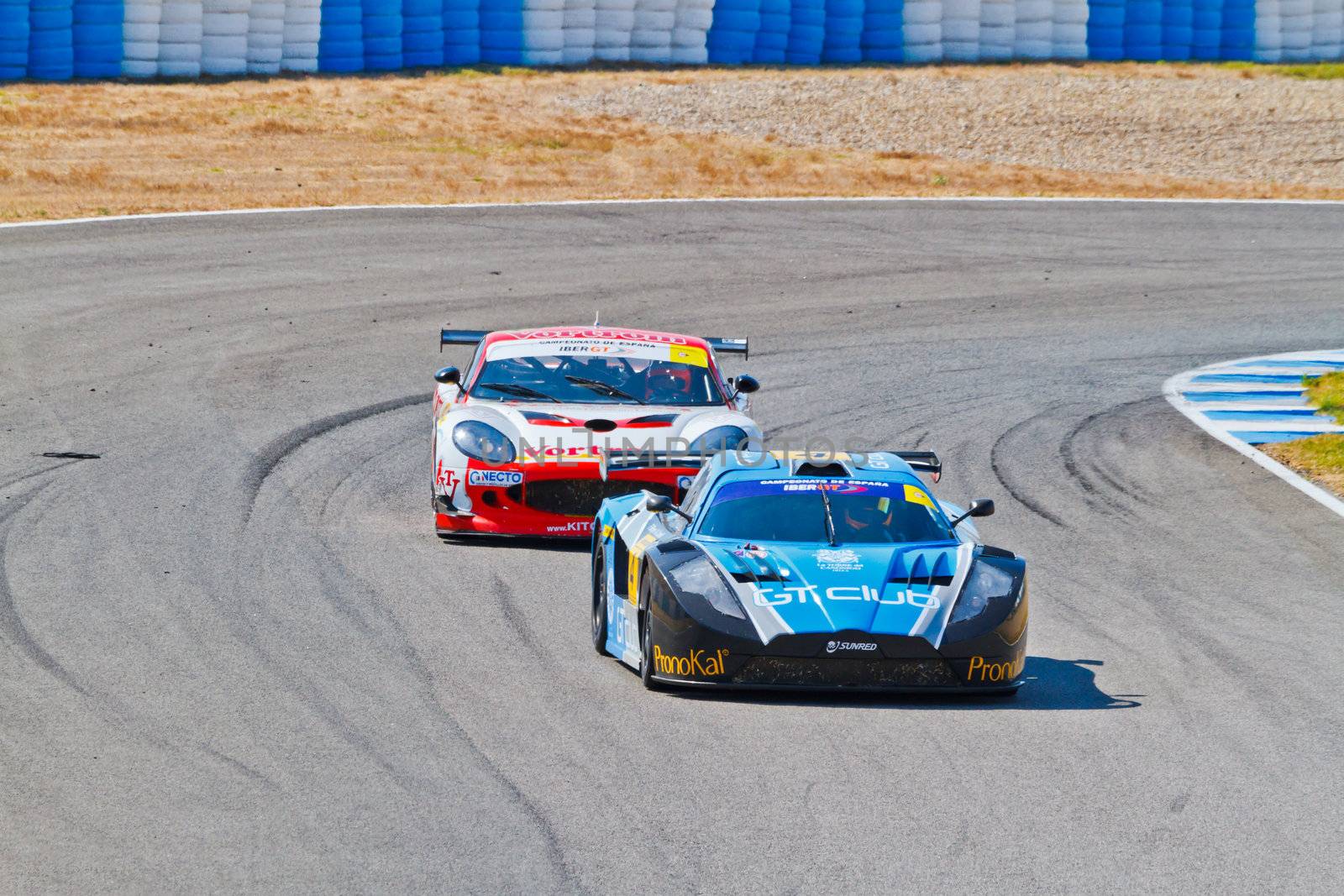 JEREZ DE LA FRONTERA, SPAIN - OCT 16: Ferran Monje(4) followed by Francesc Gutierrez(42)races on Iber GT championship on October 16 , 2011, in Jerez de la Frontera , Spain