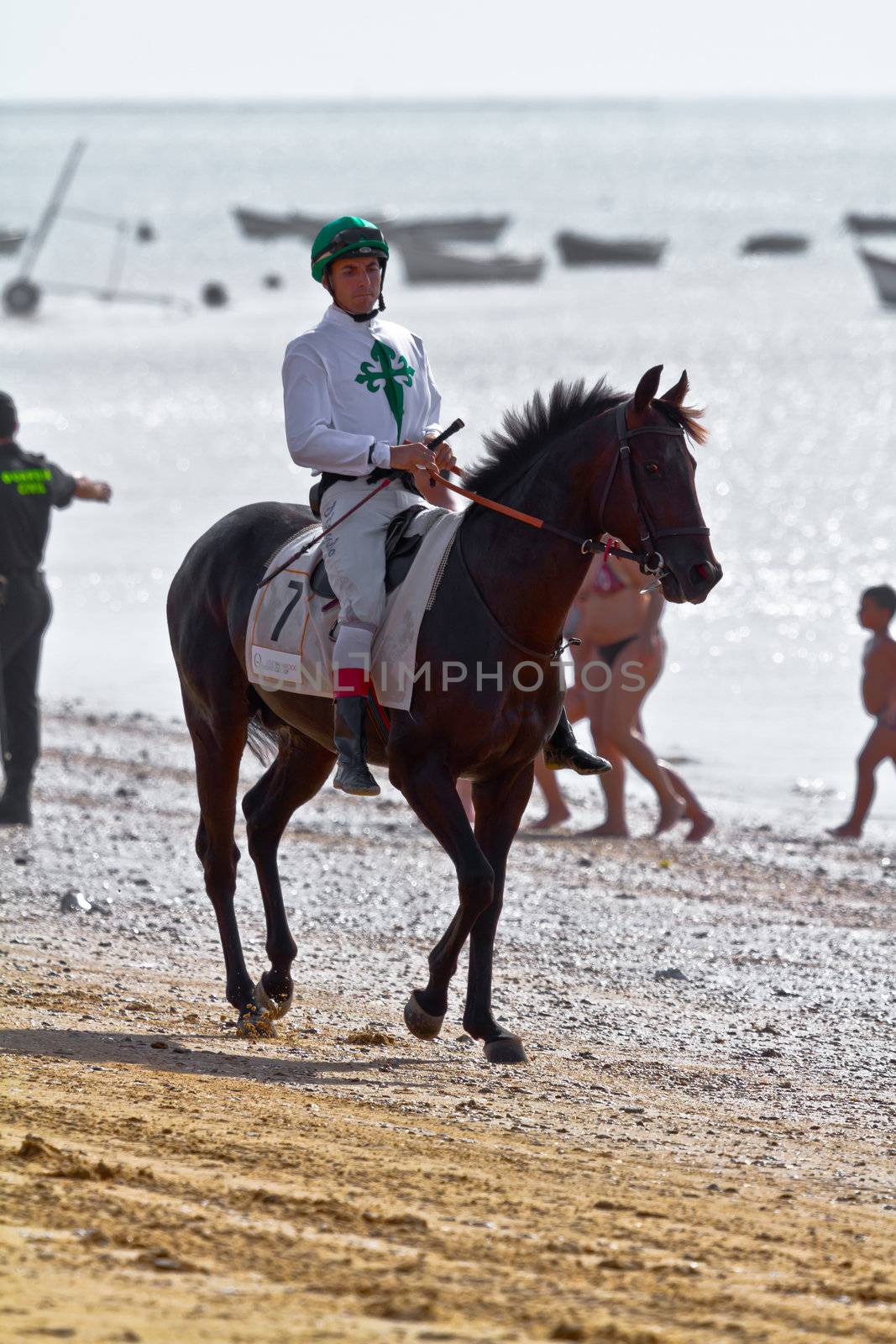 SANLUCAR DE BARRAMEDA, CADIZ, SPAIN - AUGUST 10: Unidentified rider at the start of race horses on Sanlucar de Barrameda beach on August 10, 2011 in Sanlucar de Barrameda, Cadiz, Spain.
