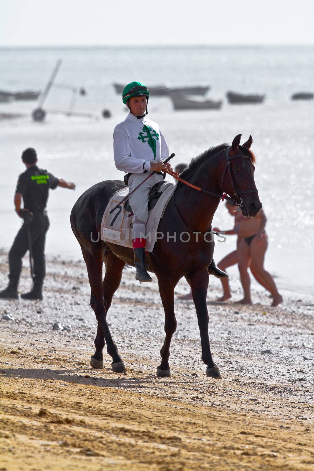 SANLUCAR DE BARRAMEDA, CADIZ, SPAIN - AUGUST 10: Unidentified rider at the start of race horses on Sanlucar de Barrameda beach on August 10, 2011 in Sanlucar de Barrameda, Cadiz, Spain.