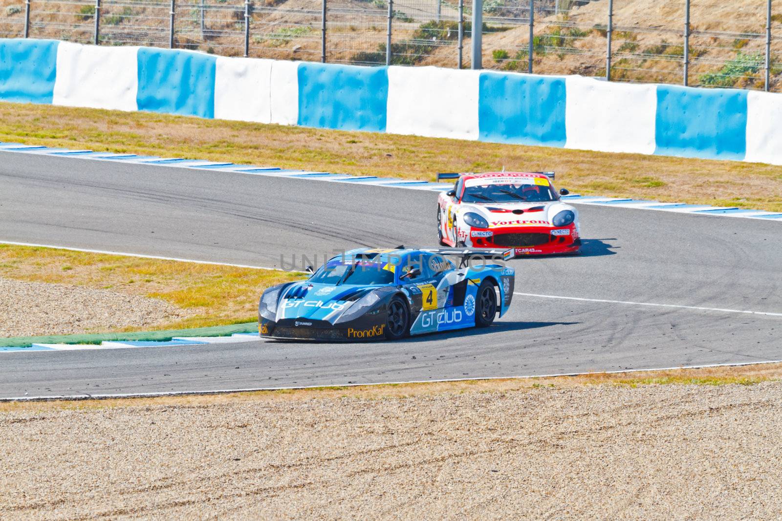 JEREZ DE LA FRONTERA, SPAIN - OCT 16: Ferran Monje(4) followed by Francesc Gutierrez(42)races on Iber GT championship on October 16 , 2011, in Jerez de la Frontera , Spain