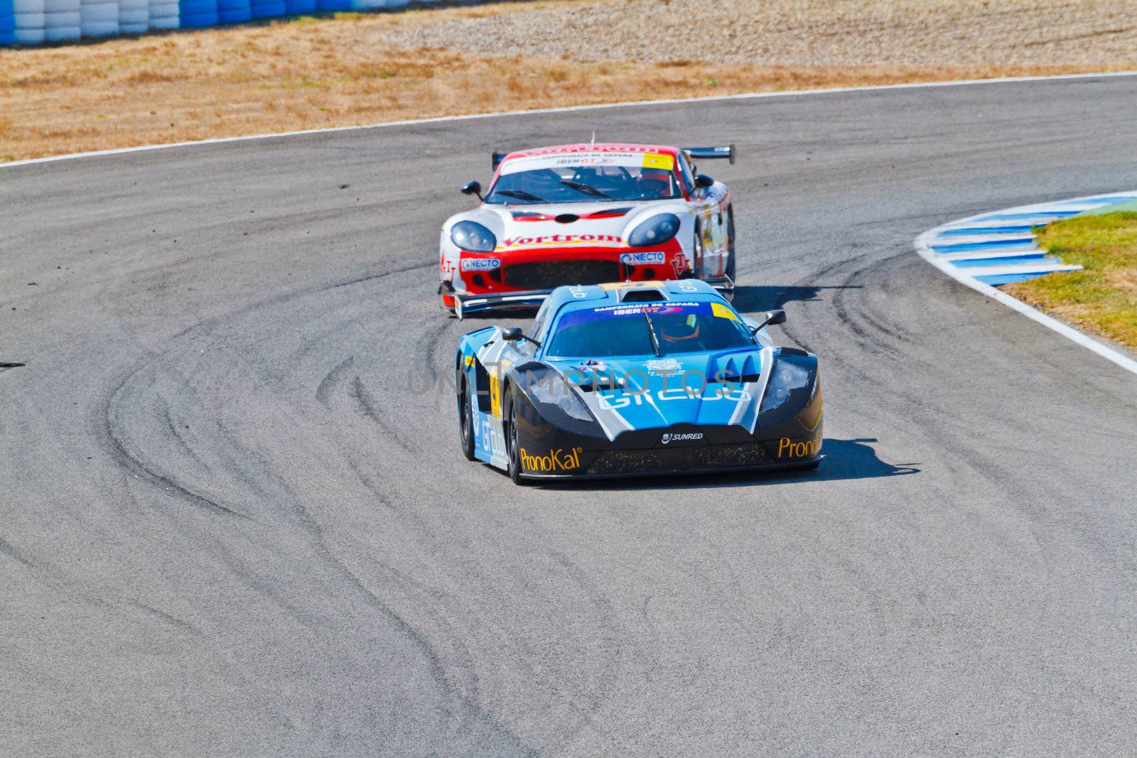 JEREZ DE LA FRONTERA, SPAIN - OCT 16: Ferran Monje(4) followed by Francesc Gutierrez(42)races on Iber GT championship on October 16 , 2011, in Jerez de la Frontera , Spain