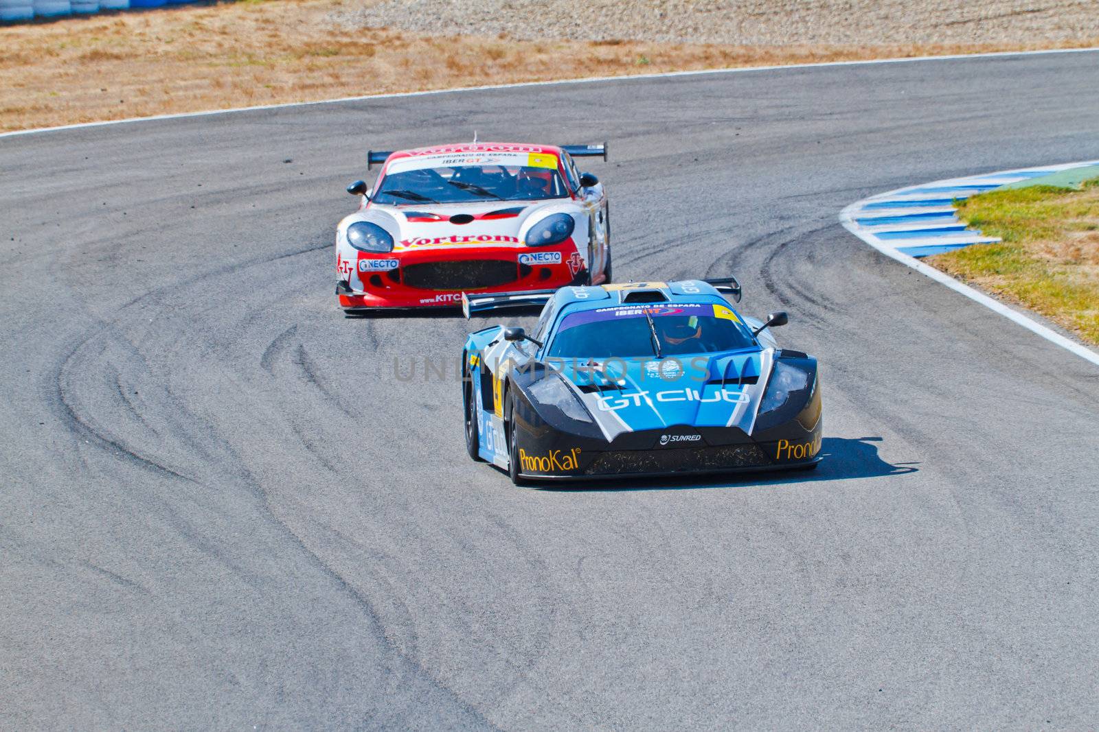 JEREZ DE LA FRONTERA, SPAIN - OCT 16: Ferran Monje(4) followed by Francesc Gutierrez(42)races on Iber GT championship on October 16 , 2011, in Jerez de la Frontera , Spain