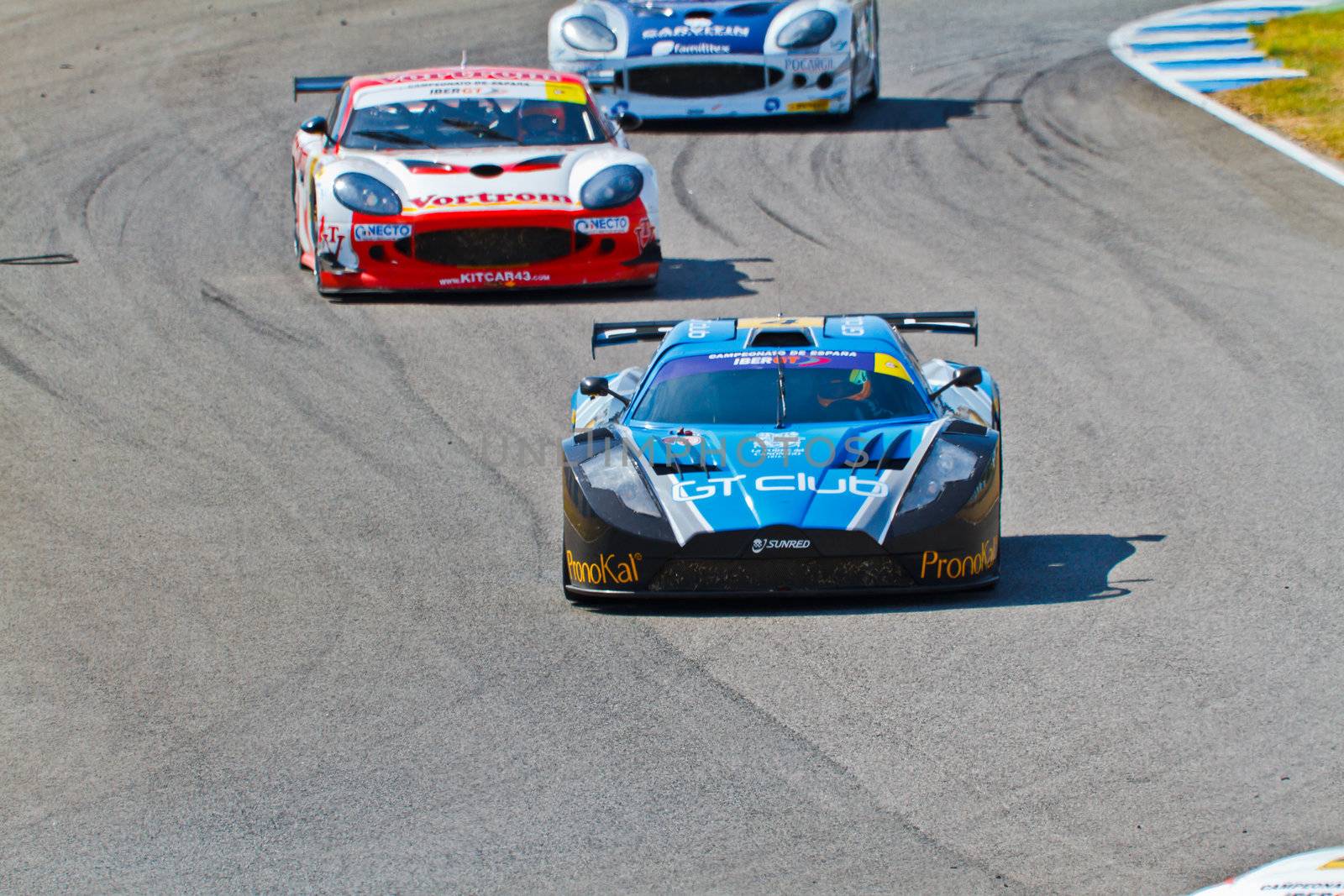 JEREZ DE LA FRONTERA, SPAIN - OCT 16: Ferran Monje(4) followed by Francesc Gutierrez(42) and Pedro Lopes(44) races on Iber GT championship on October 16 , 2011, in Jerez de la Frontera , Spain