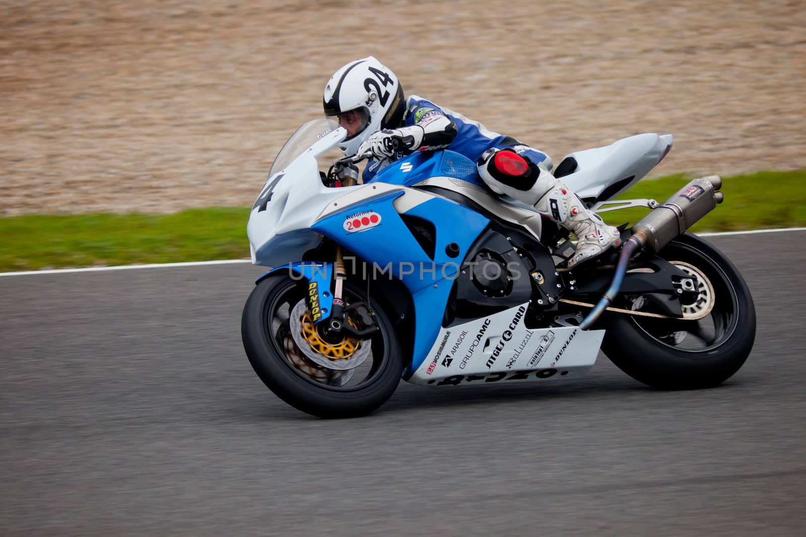 JEREZ DE LA FRONTERA, SPAIN - NOV 20: Stock Extreme motorcyclist Oscar Rodriguez takes a curve in the CEV championship on Nov 20, 2010, in Jerez de la Frontera, Spain