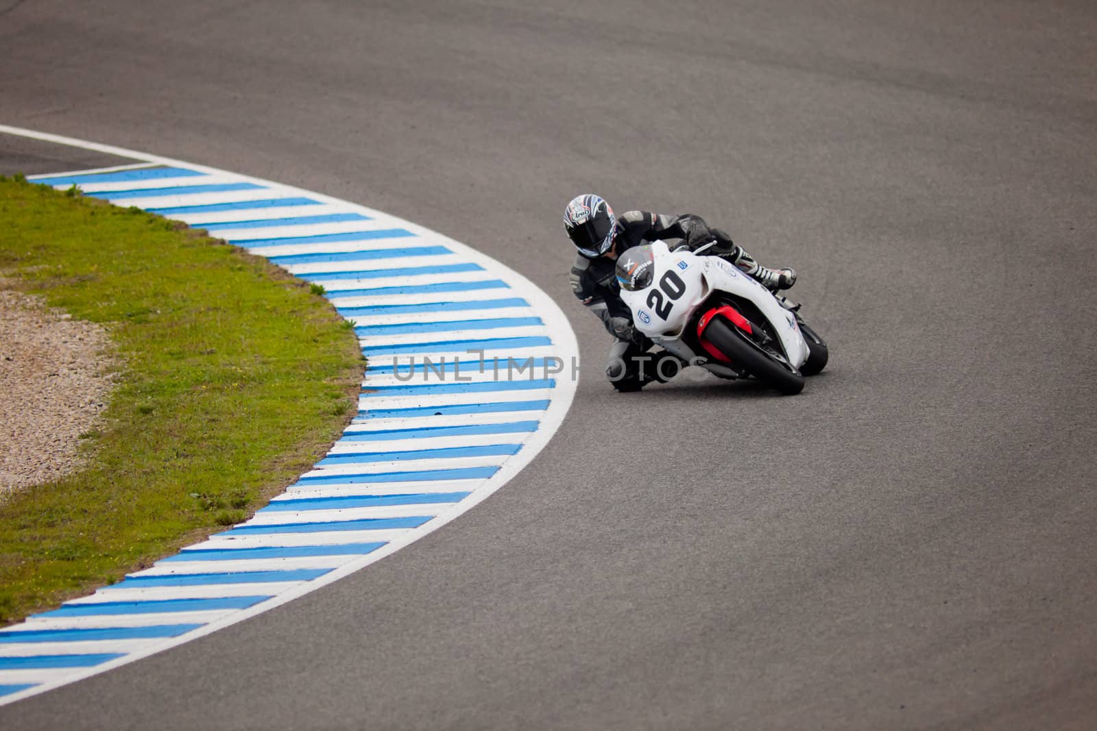 JEREZ DE LA FRONTERA, SPAIN - NOV 20: Stock Extreme motorcyclist Juan Alonso takes a curve in the CEV championship on Nov 20, 2010, in Jerez de la Frontera, Spain
