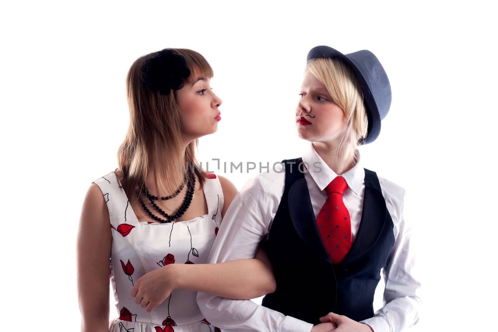 Two girls will wipe friend on friend, girl with drawn moustache in hat