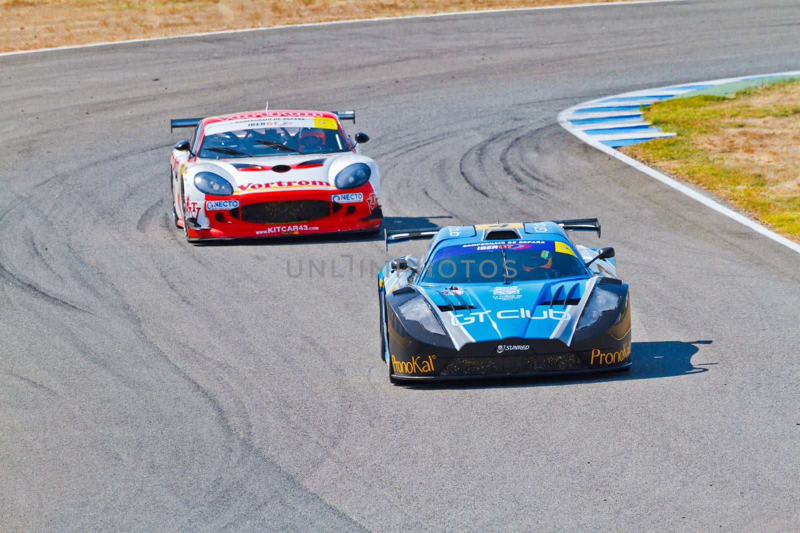 JEREZ DE LA FRONTERA, SPAIN - OCT 16: Ferran Monje(4) followed by Francesc Gutierrez(42)races on Iber GT championship on October 16 , 2011, in Jerez de la Frontera , Spain