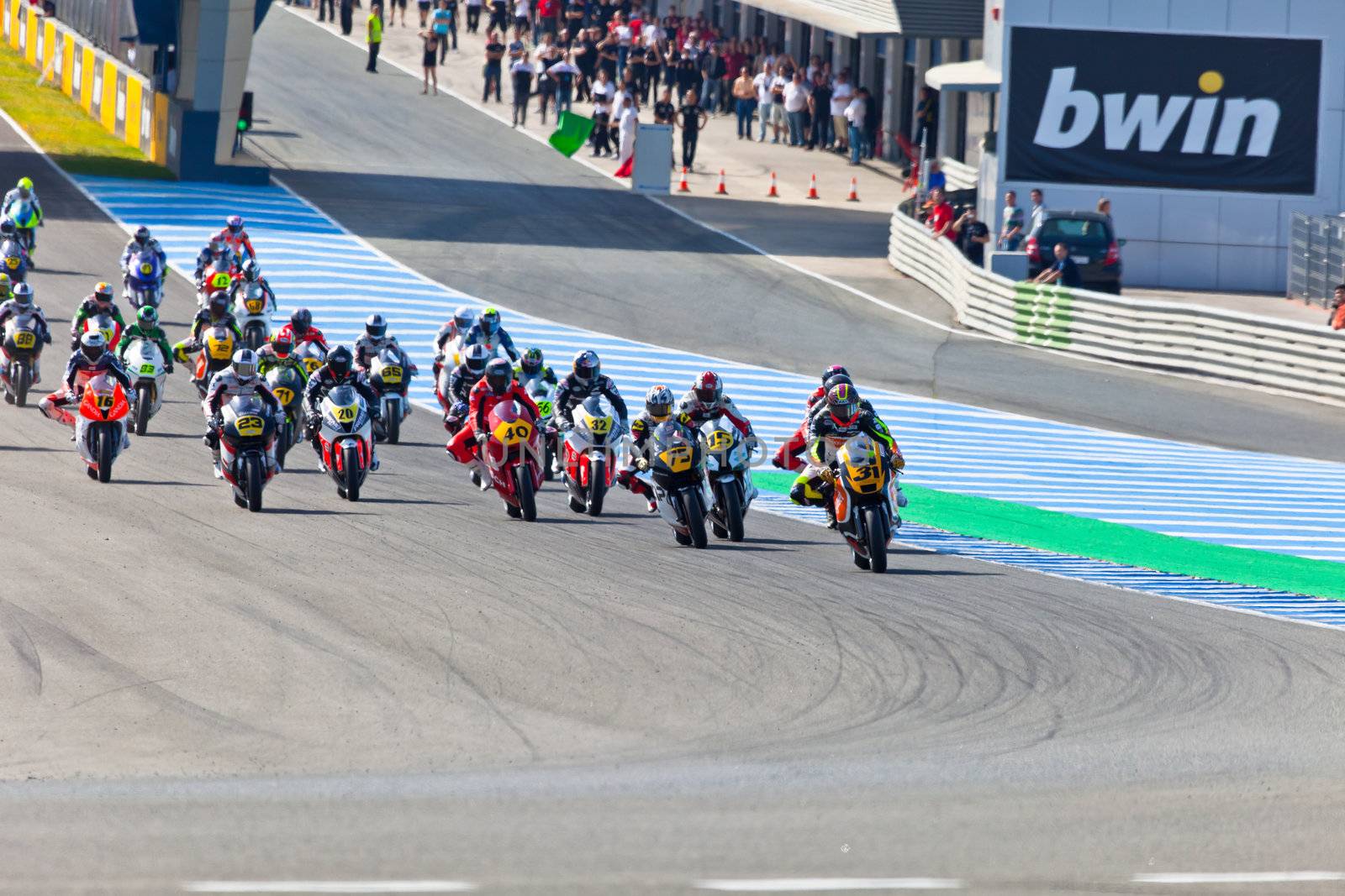 JEREZ DE LA FRONTERA, SPAIN - APR 17: Motorbike competitors begin the Moto2 race in the CEV Championship on April 17, 2011 in Jerez de la Frontera, Spain.