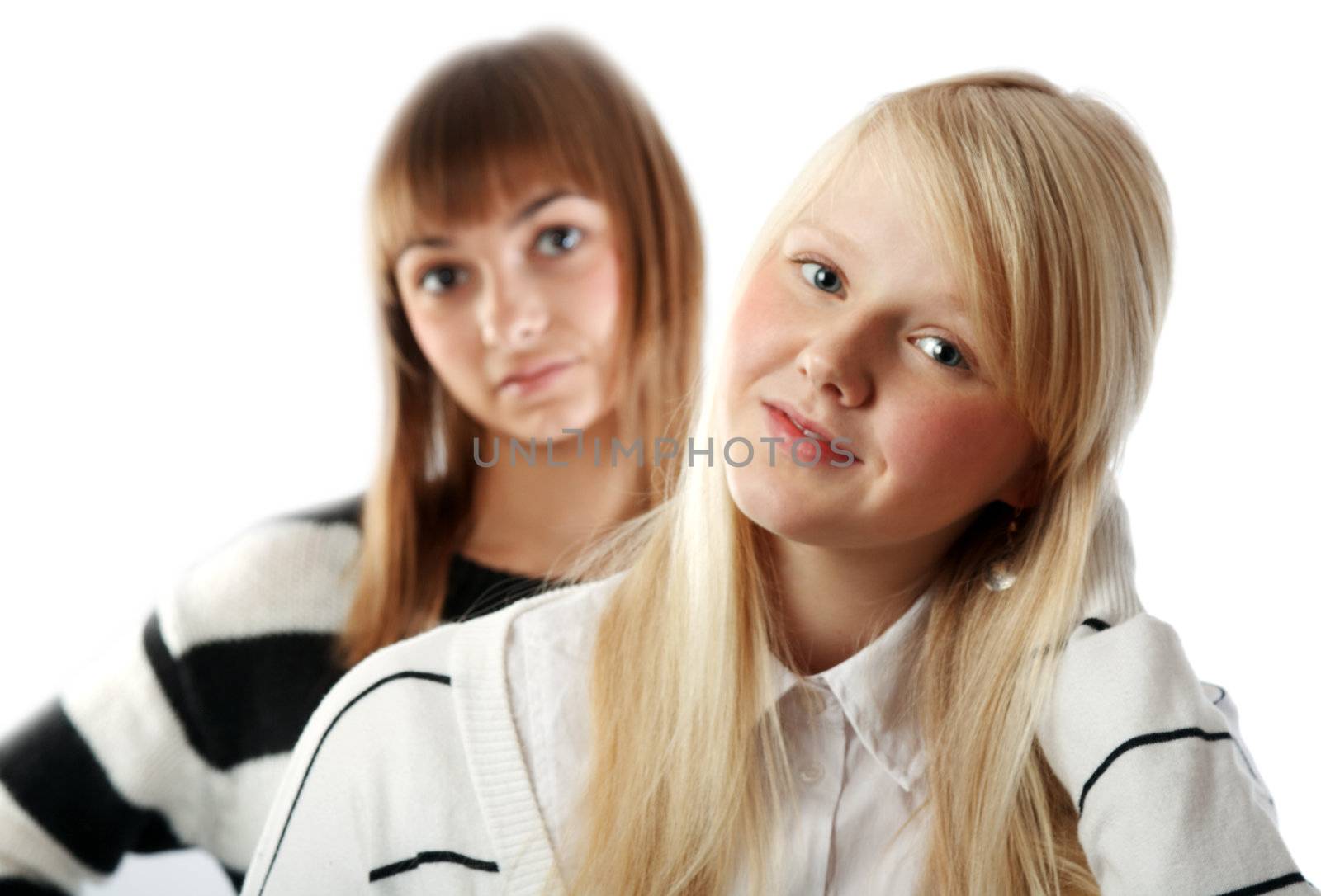 Portrait two girls small depth to sharpnesses on white background