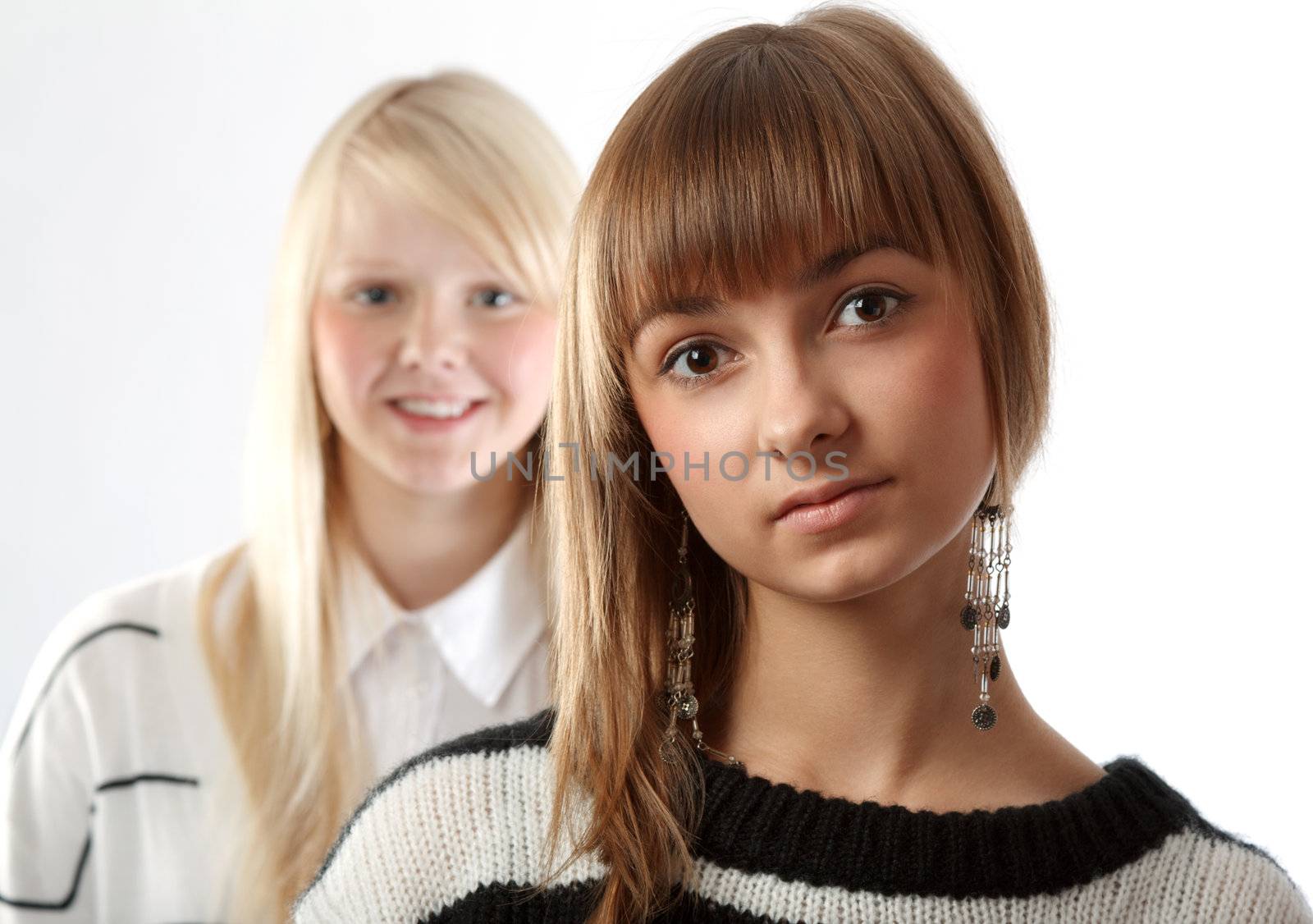 Portrait two girls small depth to sharpnesses on white background