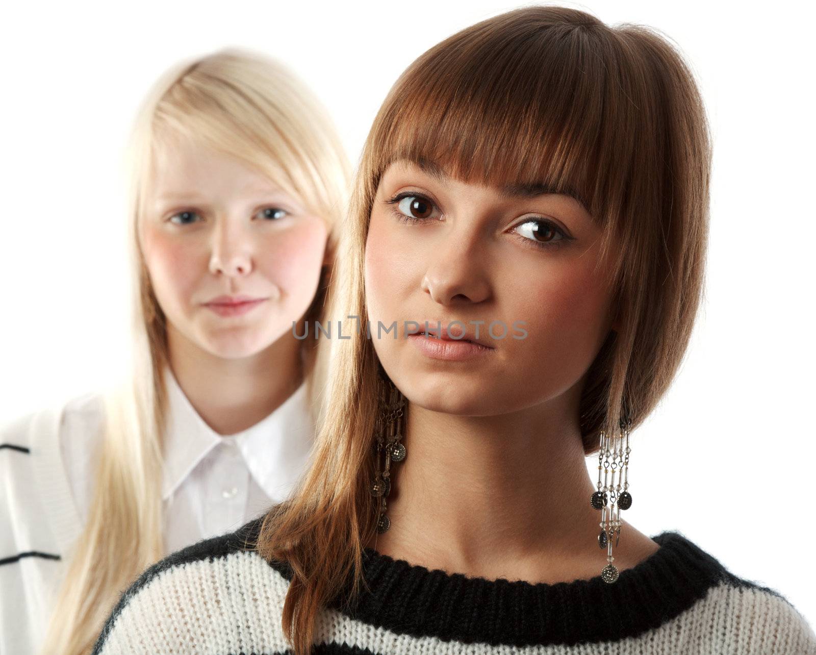 Portrait two girls small depth to sharpnesses on white background