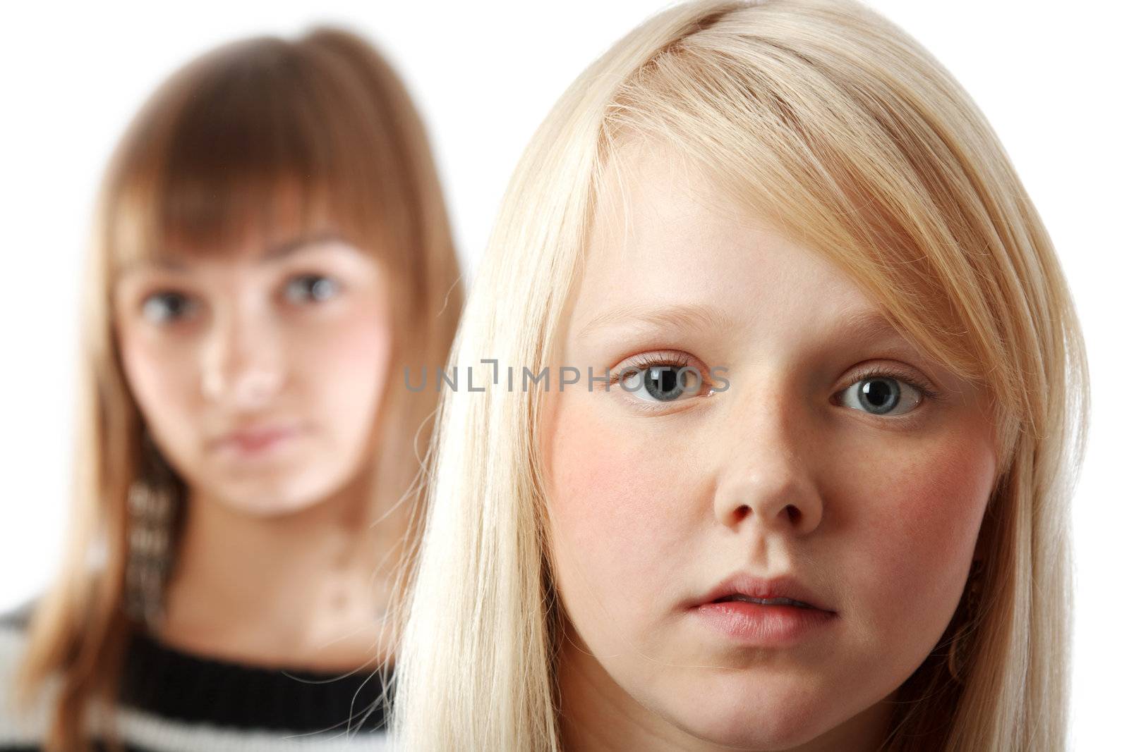 Portrait two girls small depth to sharpnesses on white background