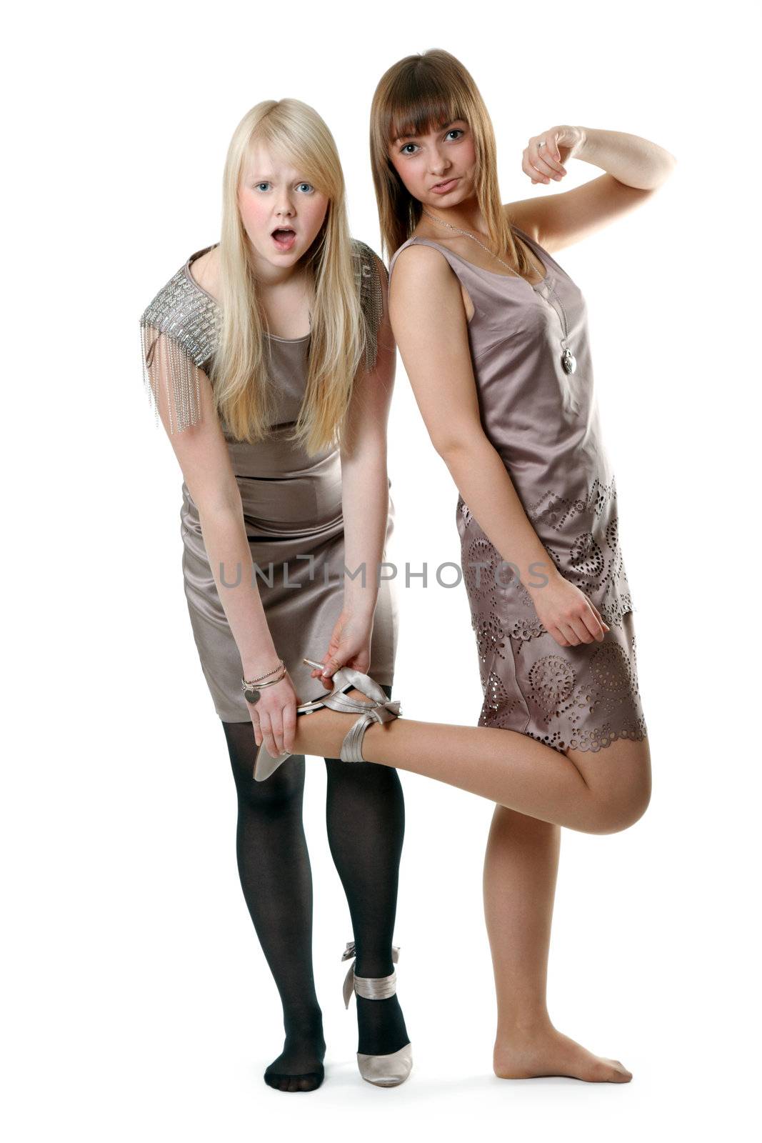 Two beautiful girls in gown on white background