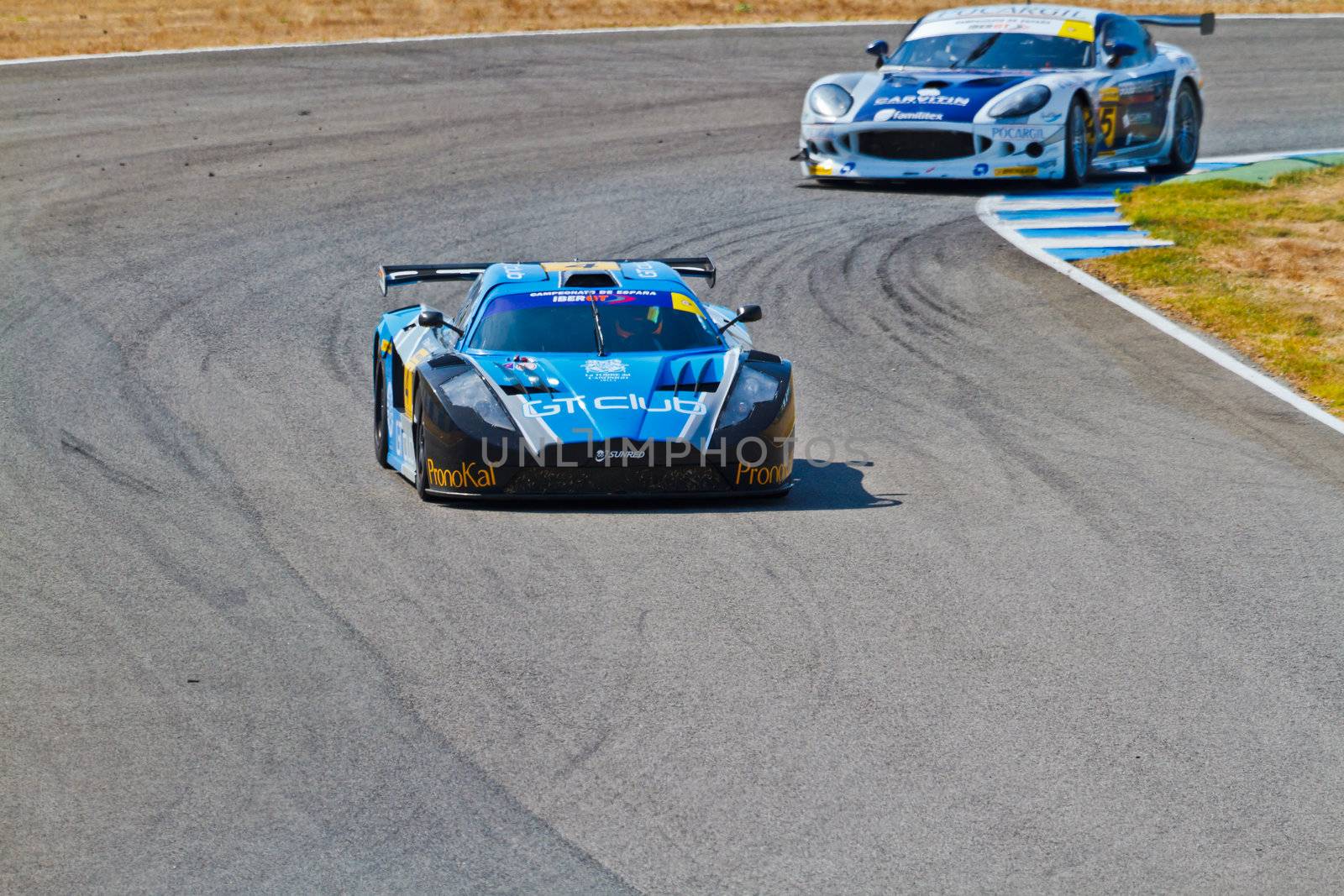JEREZ DE LA FRONTERA, SPAIN - OCT 16: Ferran Monje(4) followed by Pedro Lopes(44) races on Iber GT championship on October 16 , 2011, in Jerez de la Frontera , Spain