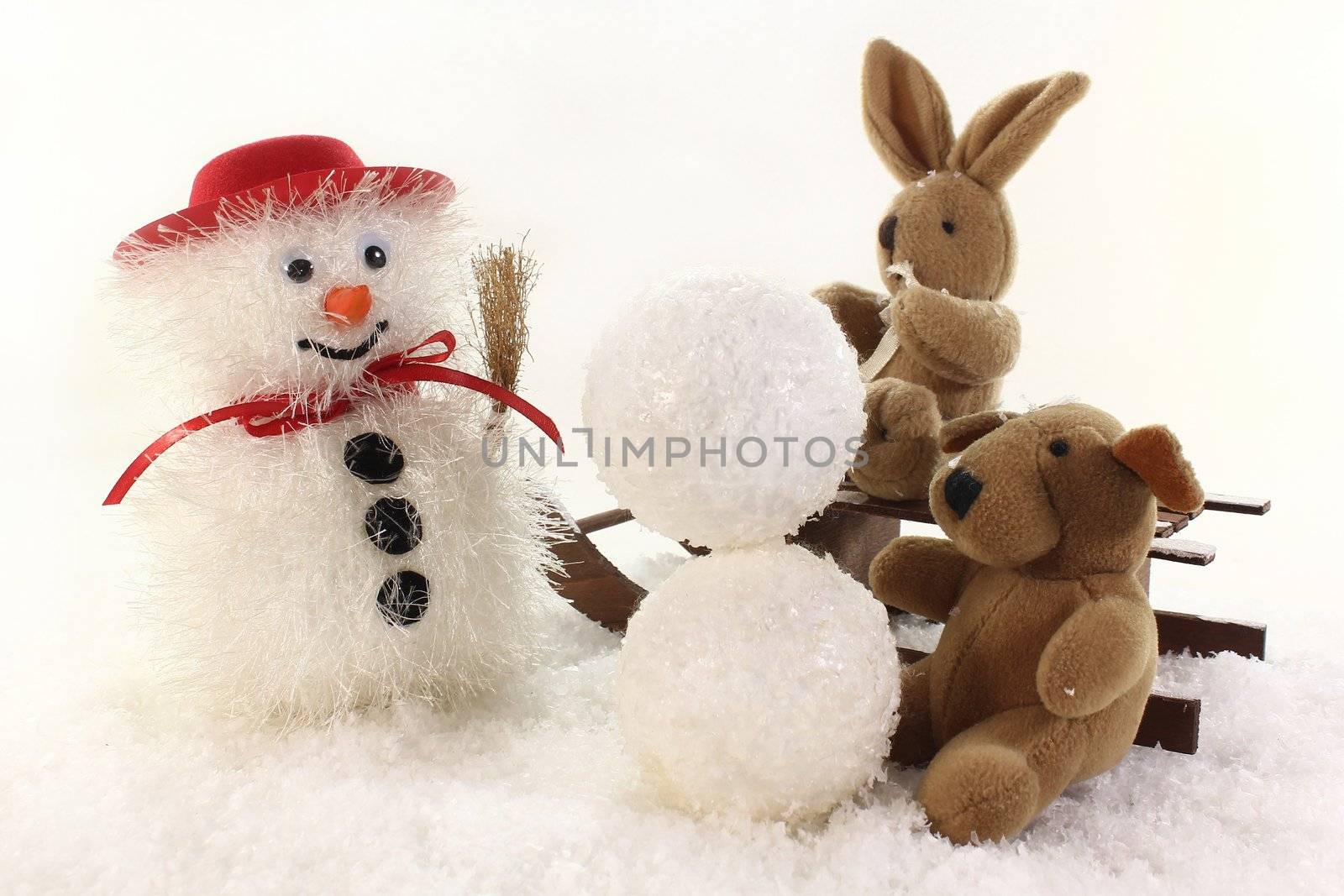 Snowman and stuffed animals for winter fun