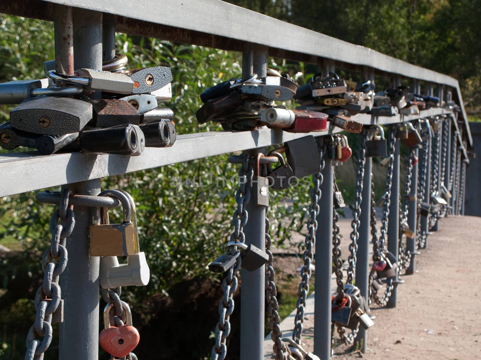 Closed wedding padlock on bridge - symbol of love