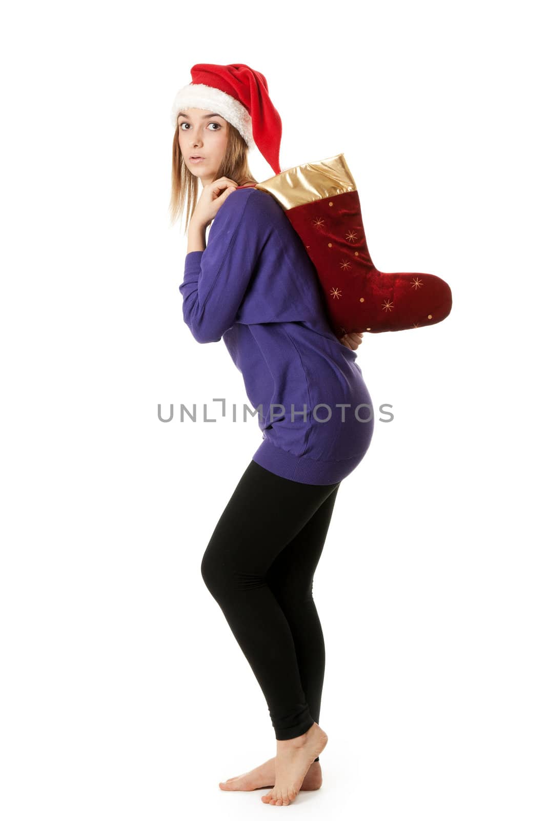 Beautiful girl in red Santa hat on a white background