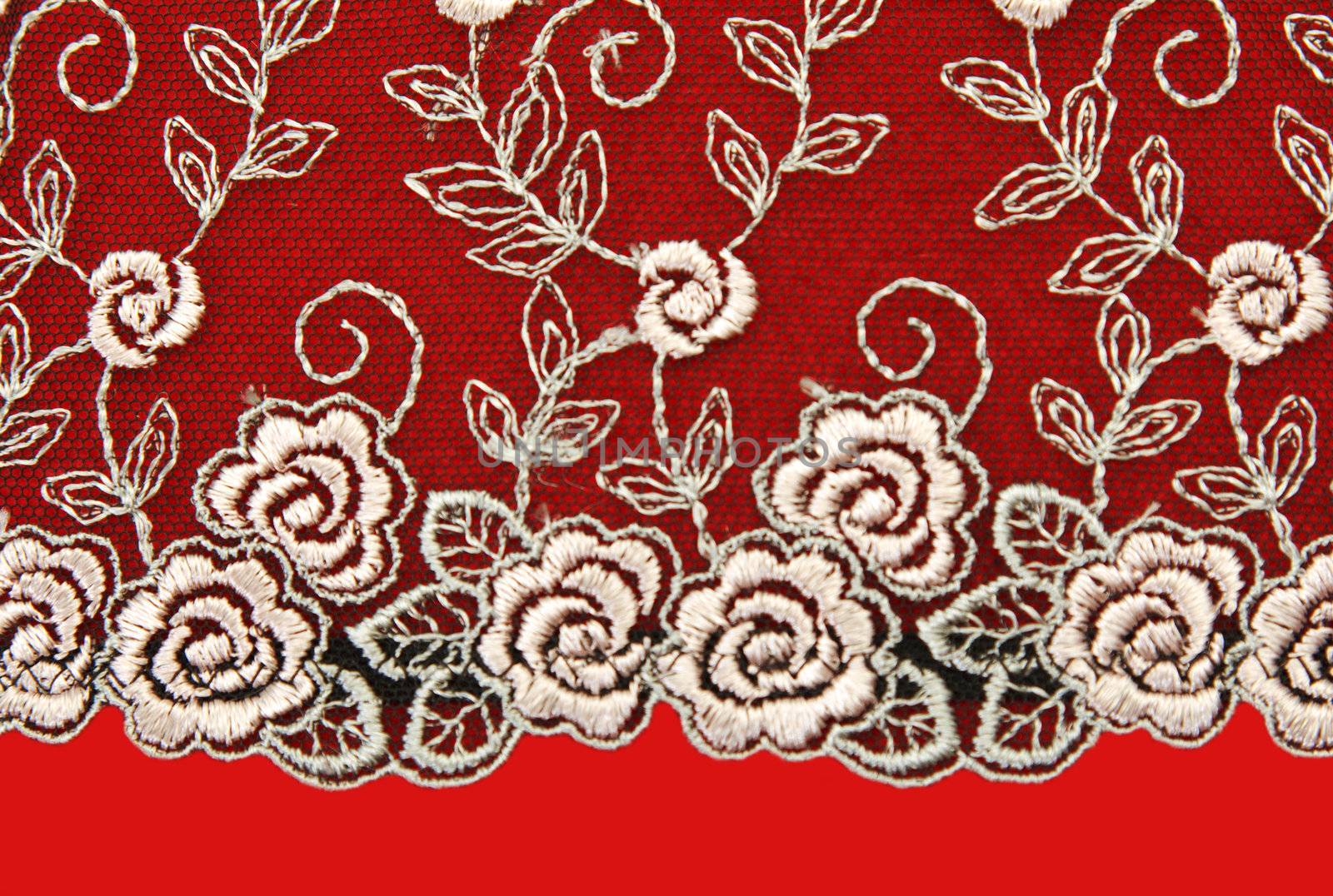 Black lace with pattern rose flowerses on red background