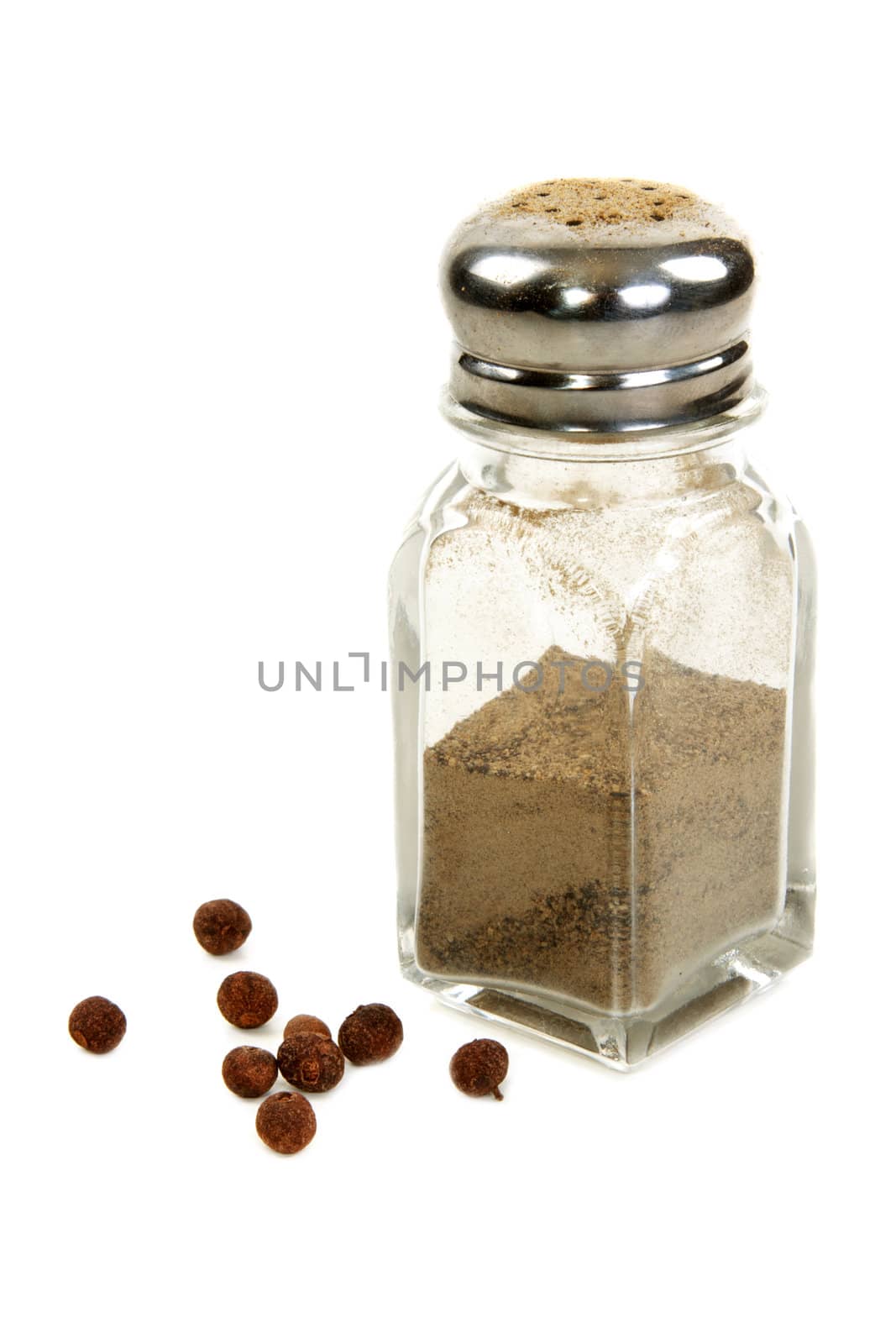 Pepper shaker and disposit black round pepper on white background